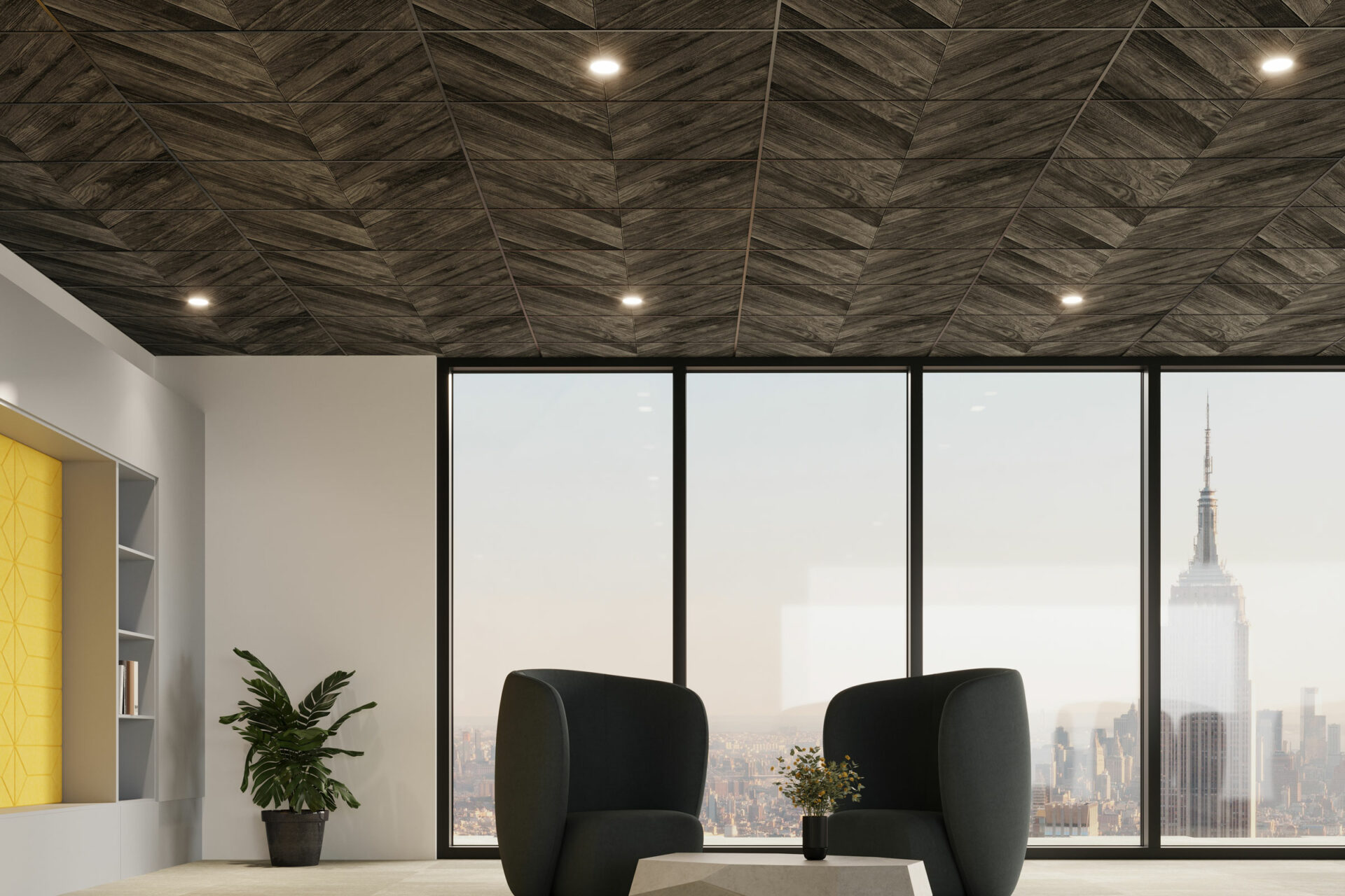 A modern office with a view, featuring two black chairs and a geometric coffee table. The ceiling boasts dark herringbone-patterned printed acoustic felt panels, while large windows display a skyline with a prominent skyscraper. A small potted plant sits near a wall with built-in shelves.