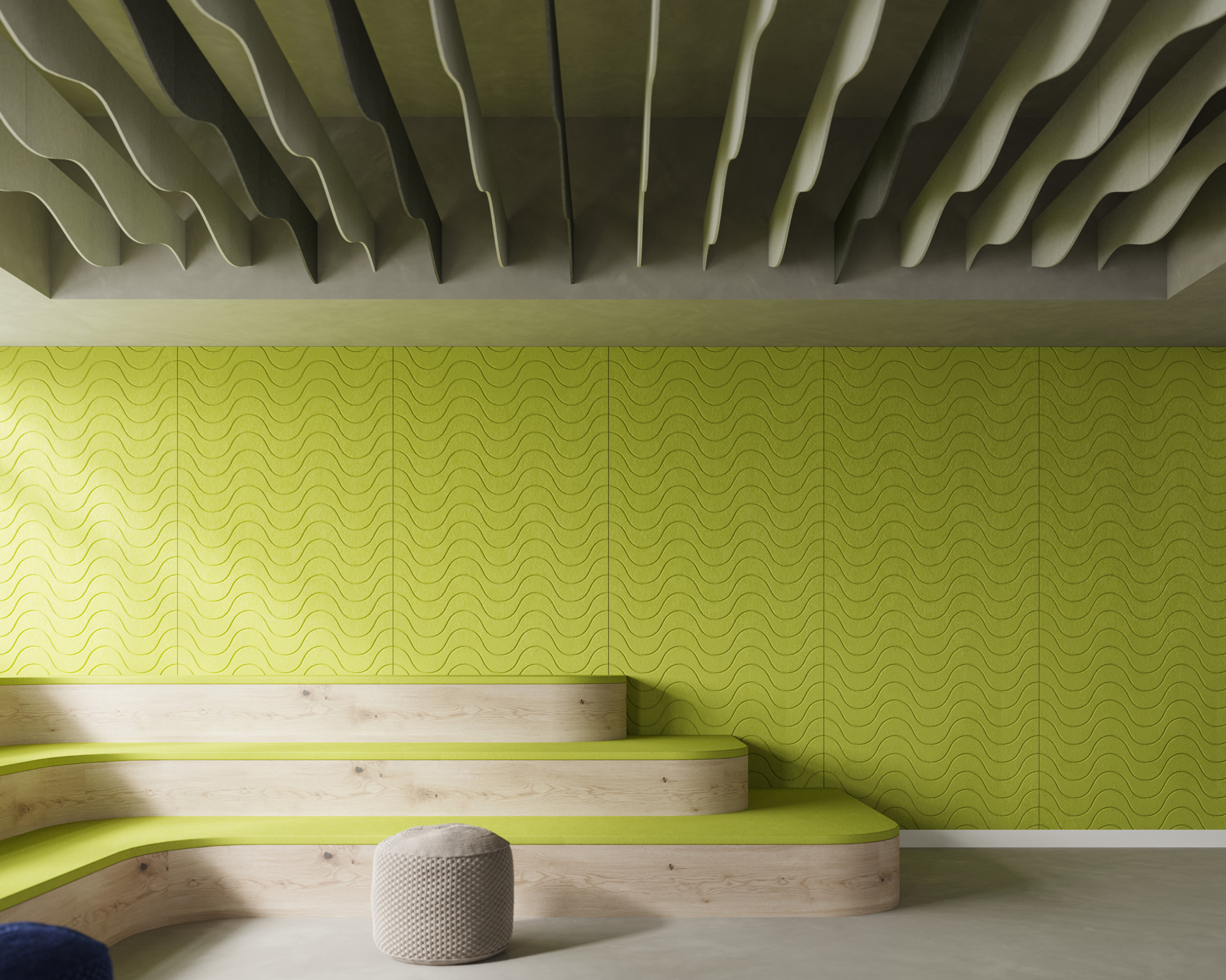 The room boasts a lime green wall with a wavy acoustic felt design. Wooden tiered seating with lime green cushions is positioned against it, complemented by a beige cushioned ottoman on the smooth floor. The ceiling features irregular, wave-shaped acoustic panels, creating an almost wavelength effect throughout the space.