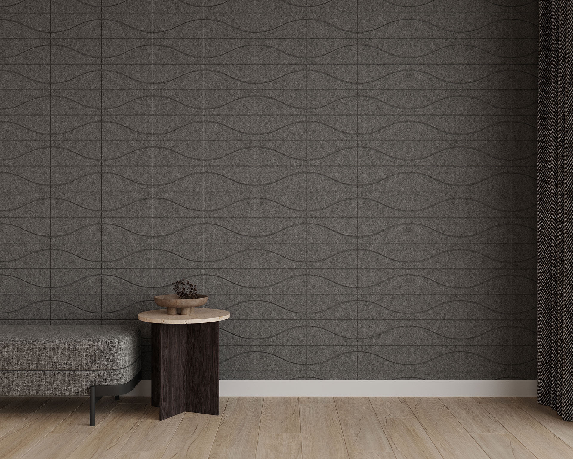 A minimalist room features a gray bench, a small round wooden side table with a plant pot, and dark curtains. The wall has acoustic felt wall tiles in subtle wave patterns of gray tones. The light wood floor enhances the simple and modern atmosphere.