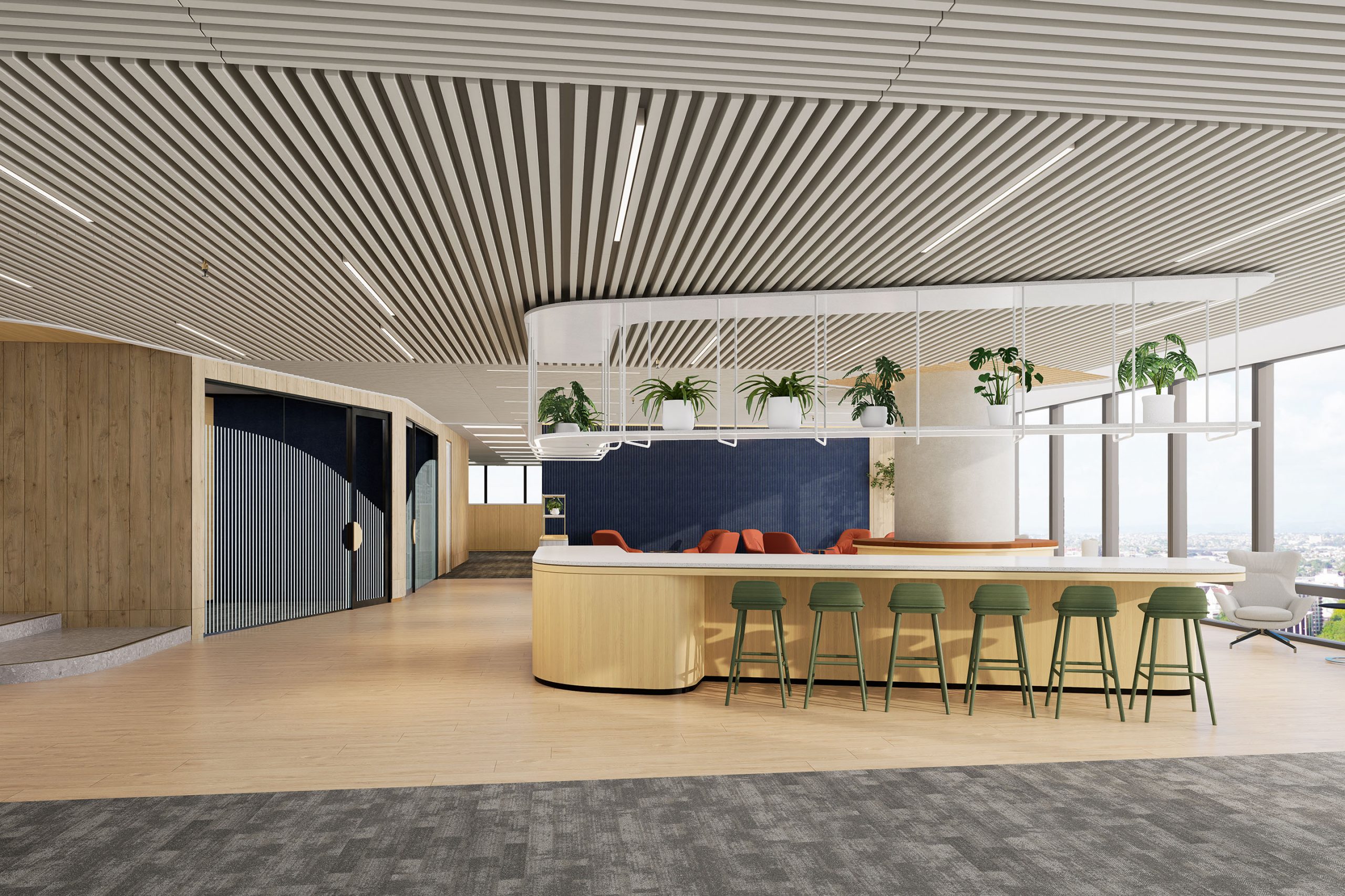Modern office space featuring a curved, wood-finished bar with green barstools, hanging plants, and dynamic wall designs. Open floor plan includes lounge seating, large windows with city views, and acoustic ceiling frames, creating a bright and welcoming environment atop the ridge of the building.
