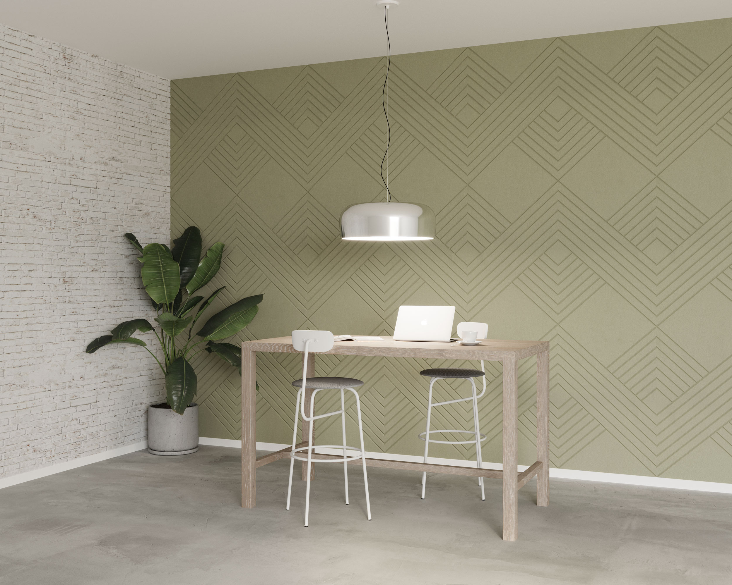 A modern minimalist workspace features a tall wooden desk with two high stools, a silver pendant light hanging above, and a laptop on the desk. The background showcases green geometric knit acoustic felt wall panels and a white brick wall. There's also a large potted plant in the corner.