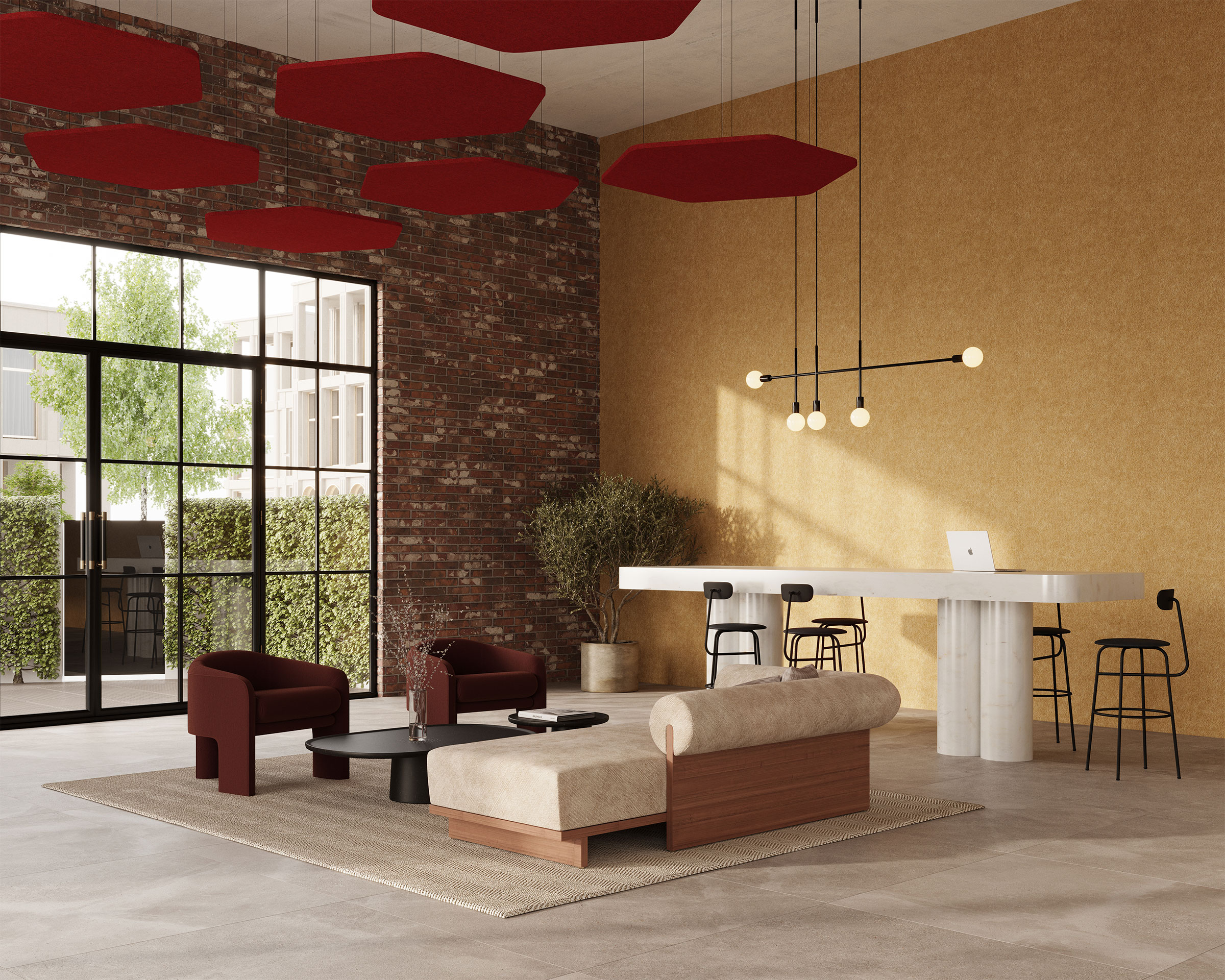 A modern minimalist living area features a beige sofa, dark red chairs, and a low black table on a textured rug. A long marble counter with black stools and a laptop is in the background. The room has large windows, exposed brick walls, and hexagon acoustic felt ceiling clouds.