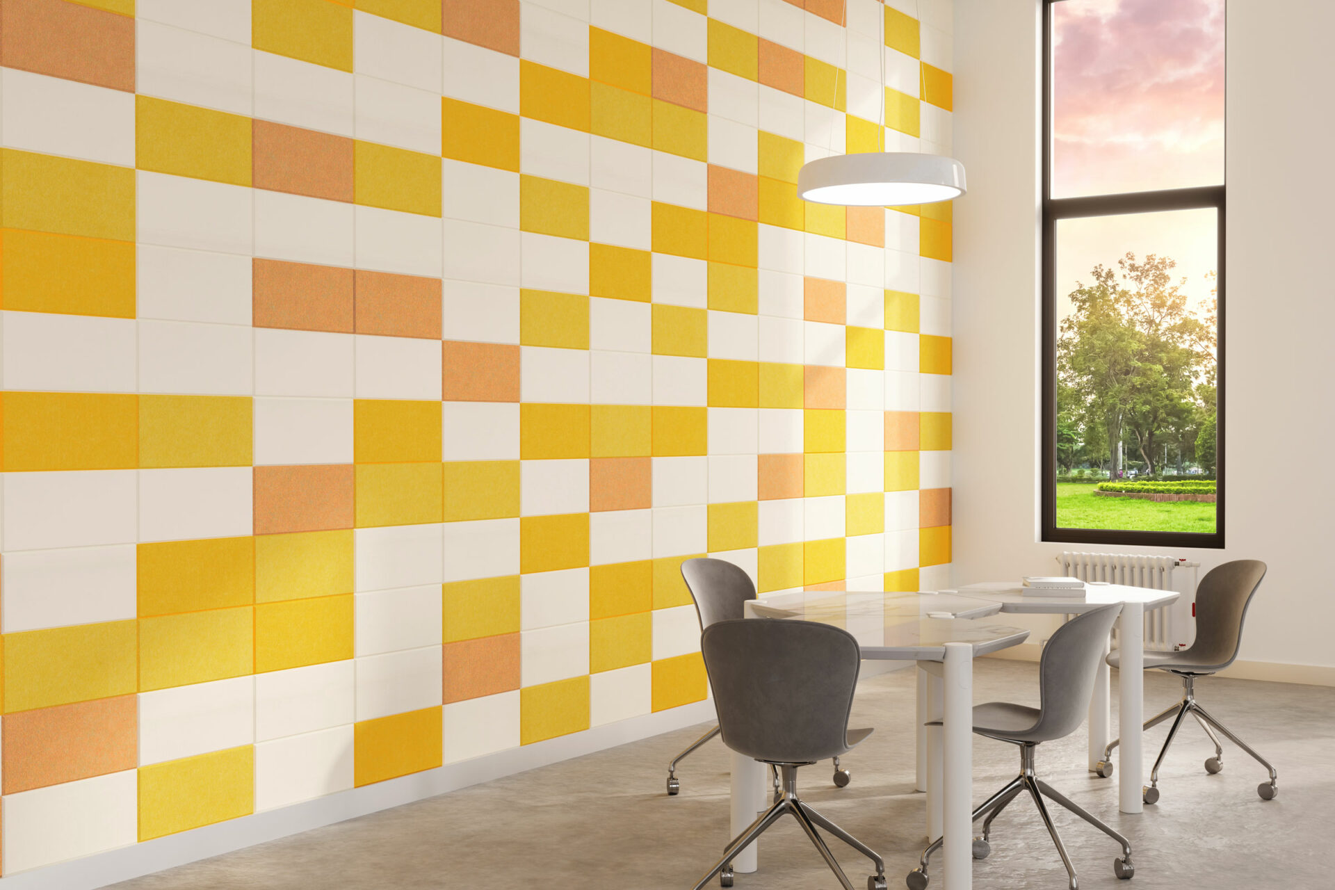 A modern office with a vibrant yellow and white checkered acoustic felt wall, a circular ceiling light, and a tall window showing a scenic view outside. In the room, there's a white table with four sleek gray chairs on wheels.