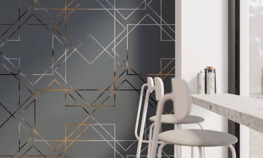 A cafe setting, with a feature wall of masonry art and squares printed on acoustic tiles, giving the impression of designs on glass or mirror. This design is by Pophouse, in collaboration with