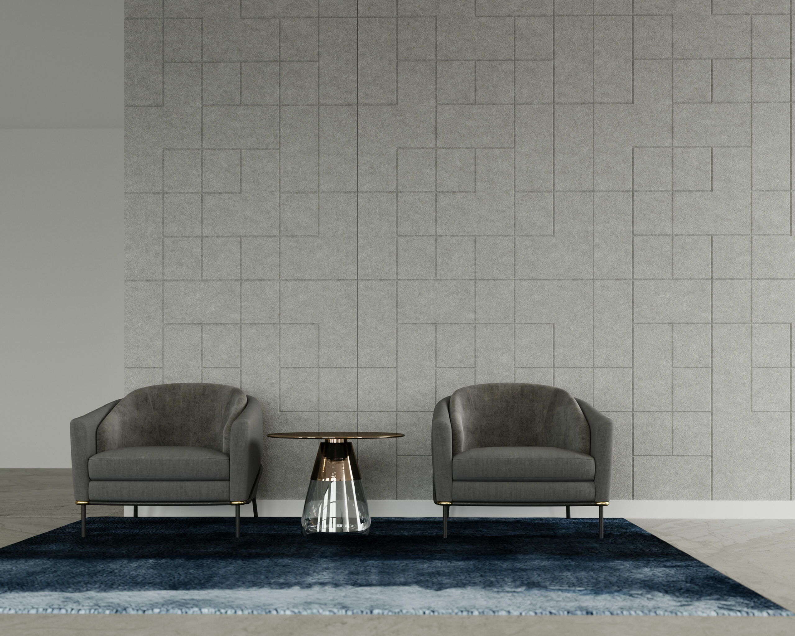 A minimalist living room features two gray upholstered armchairs on either side of a sleek glass coffee table with a black and gold base. They sit on a dark blue area rug, against a light gray wall adorned with subtle geometric patterns on acoustic felt wall panels.