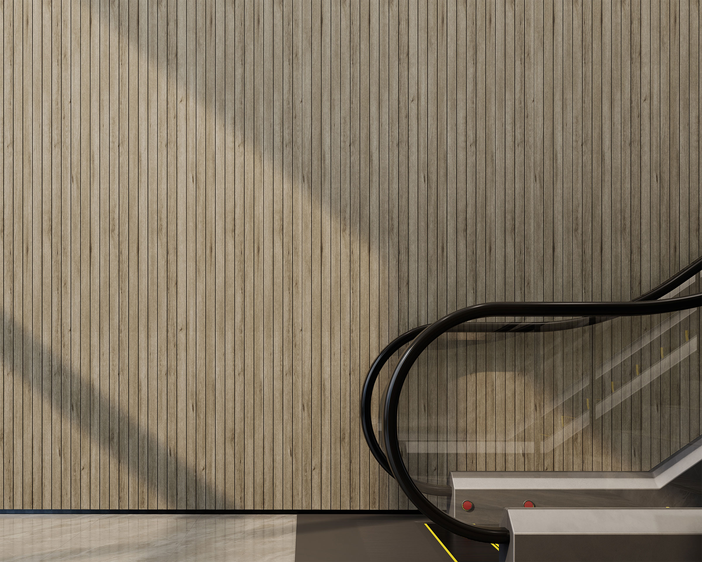 A modern escalator with black handrails and metallic steps ascends next to a tall, vertically paneled wall adorned with woodgrain acoustic felt slats. The area is brightly lit by sunlight, casting sharp shadows on the wall. The floor is made of smooth, reflective material.