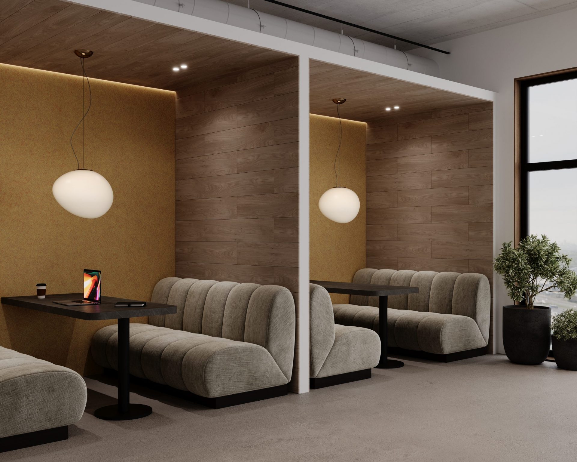 A modern, elegant cafe interior with cozy beige booths separated by wooden partitions and acoustic felt wall planks. Each booth has a black table with a pendant light hanging above it. A tablet is placed on one table, and large windows and potted plants add to the ambiance.