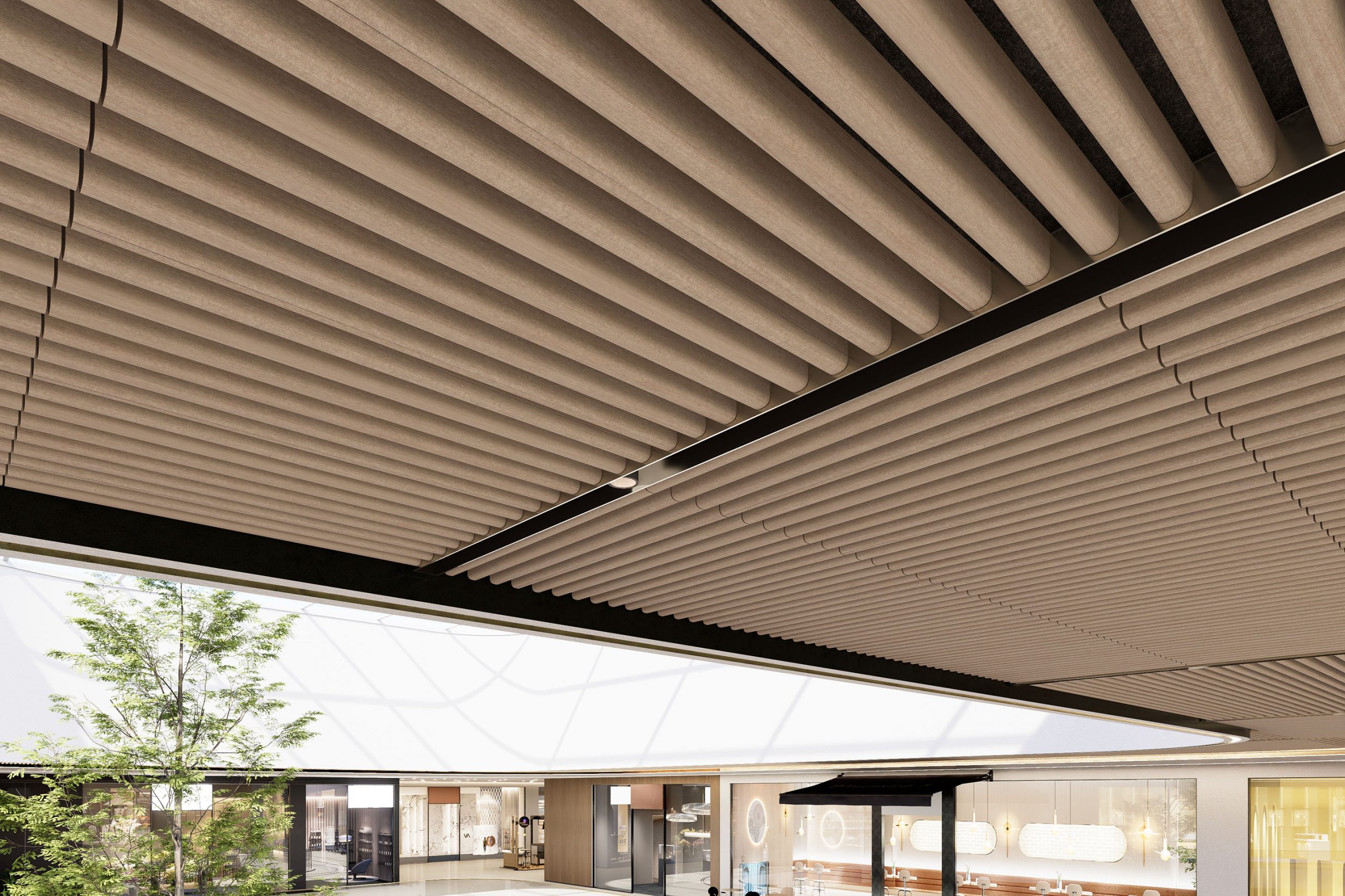 A modern indoor space features a slatted acoustic felt ceiling frame and a skylight that allows natural light to pour in. Below, a small tree stands amid a minimalist design, with sleek furnishings and large windows.