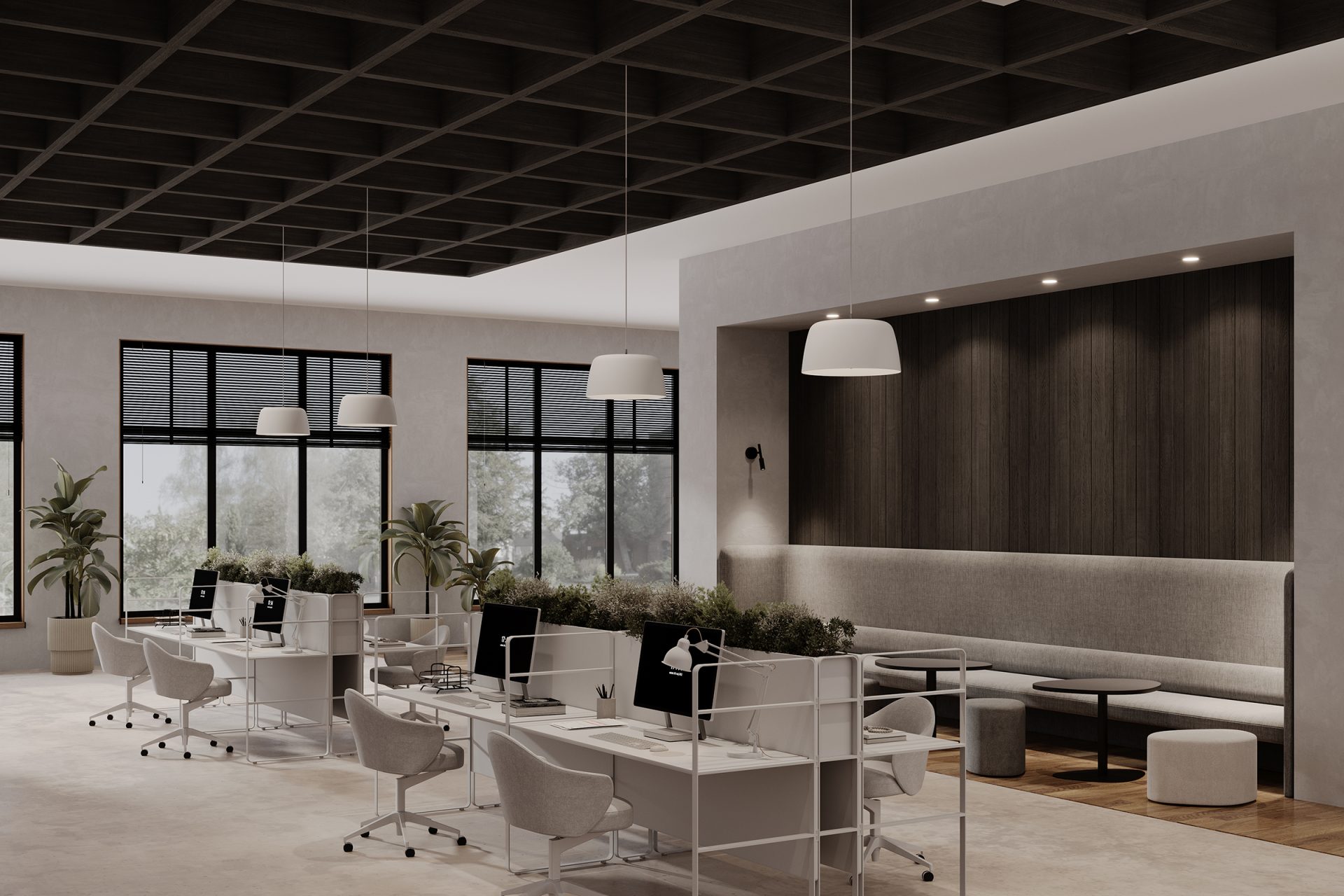 A modern office space with an open-plan design, featuring workstations with chairs and desktop computers. The ceiling boasts a dark grid framework with acoustic felt and hanging white lamps. To the right, a seating area offers a bench and small round tables. Large windows provide natural light.
