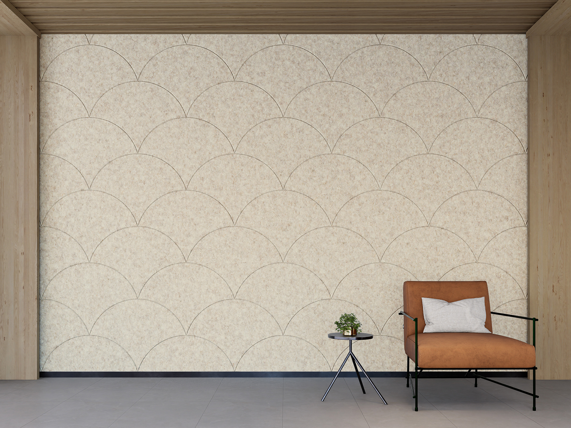 A minimalist room featuring a beige arched-patterned acoustic felt wall, a brown upholstered chair with a white pillow, and a small black side table holding a plant. The room has a grey floor and wooden trim on the walls and ceiling.