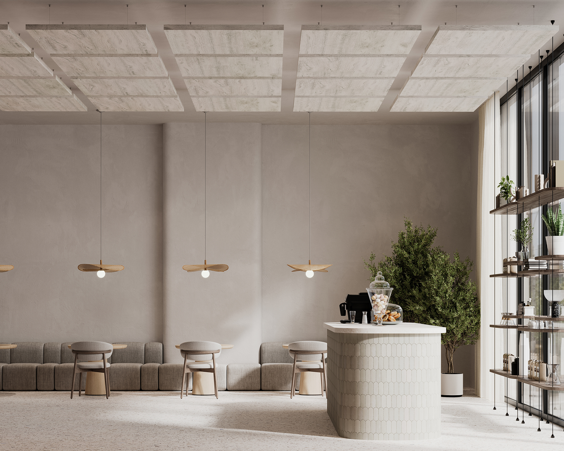 A minimalist modern cafe with beige walls, acoustic felt ceiling clouds, hanging pendant lights, and a white tiled counter. The space features a long cushion bench with small tables and chairs. Large windows bring in natural light, and shelves with plants and decor adorn the right side.