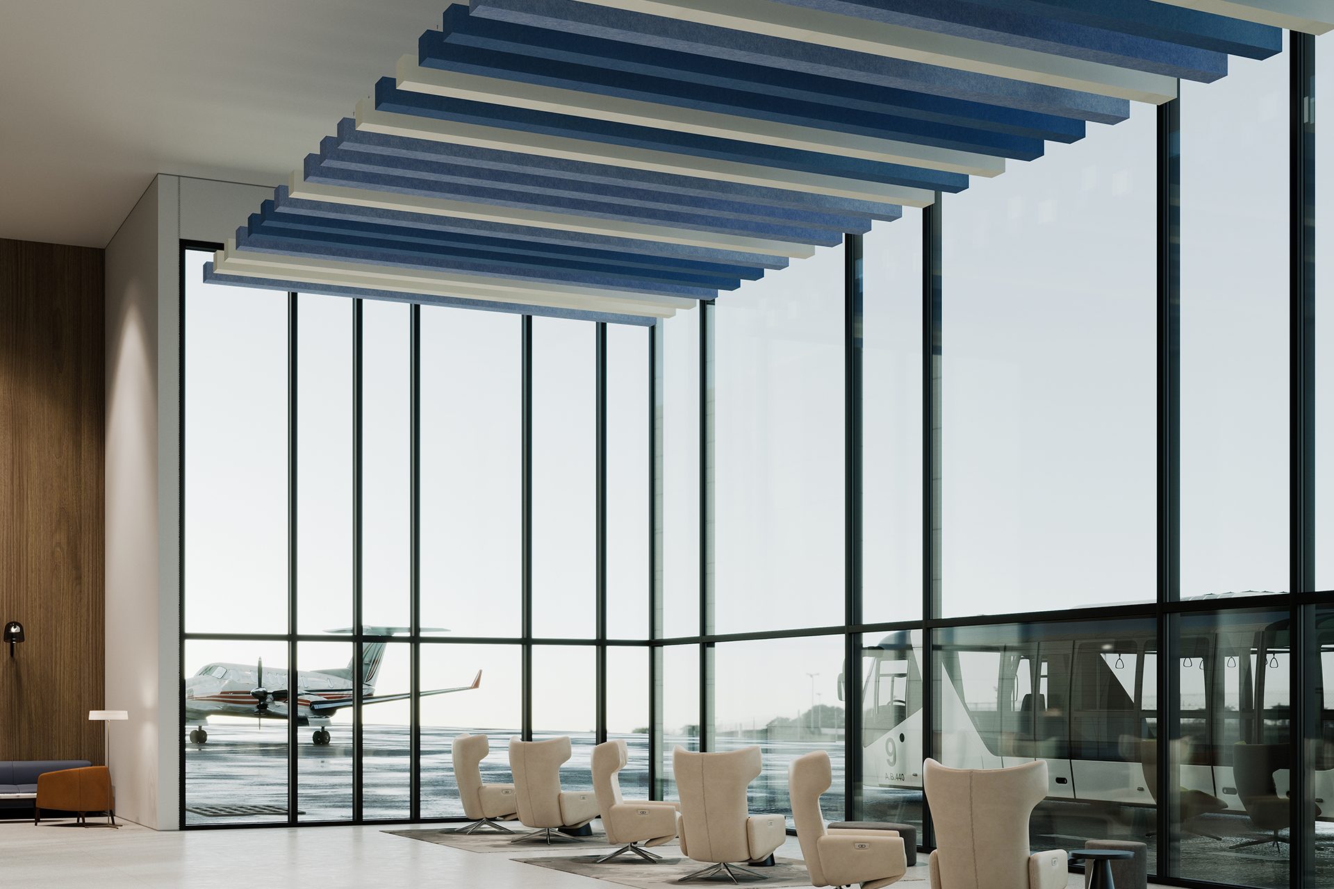 Modern airport lounge with floor-to-ceiling windows overlooking an airplane outside. The interior features comfortable armchairs and contemporary decor with blue and white acoustic felt ceiling baffles. Natural light fills the spacious area, creating a serene atmosphere.