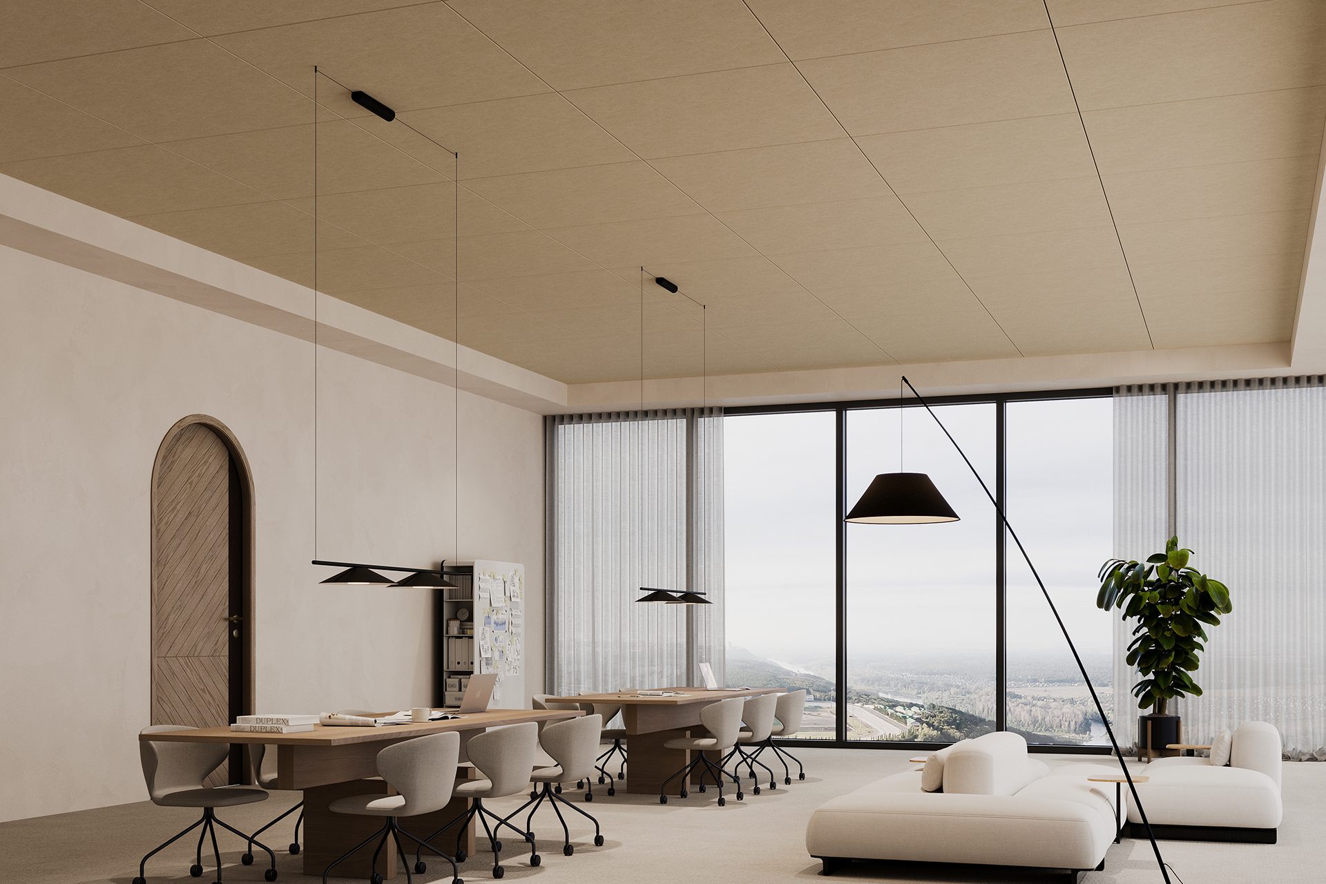 Spacious modern office with minimalist design, featuring long shared wooden desks with grey chairs, an acoustic felt ceiling, a cozy seating area with white sofas, a floor lamp, large windows with sheer curtains offering a city view, and a tall indoor plant.