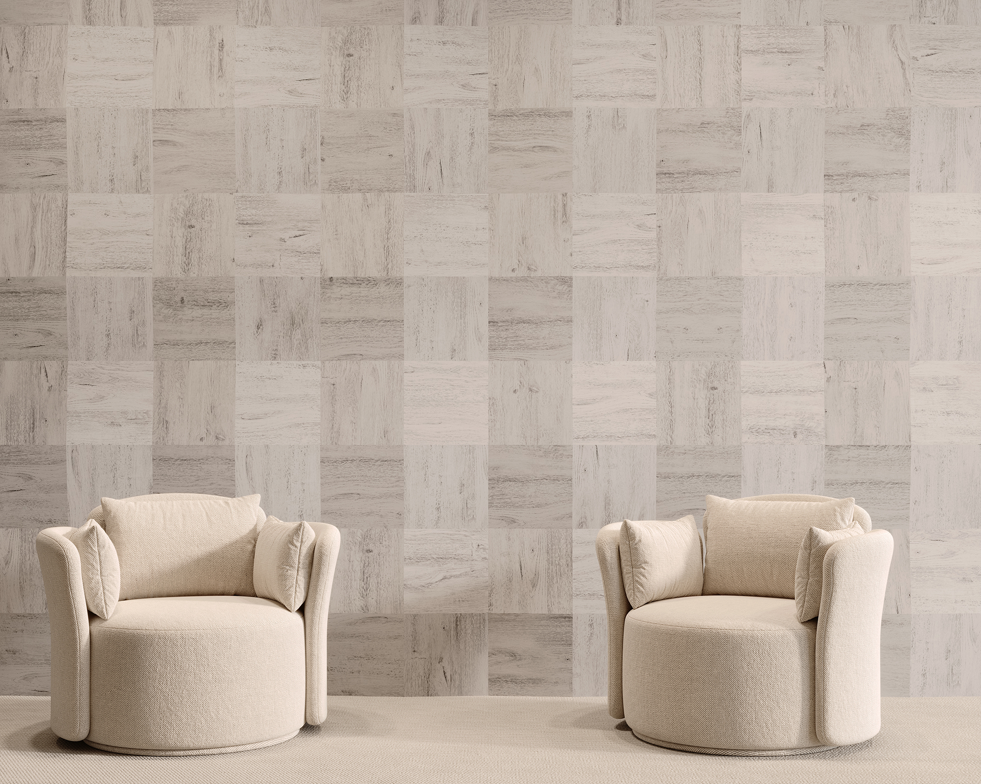 Two beige, round armchairs with cushioned backs sit facing the camera against a backdrop of slant textured, light-colored wall tiles. The chairs are placed on a light, solid-colored floor, creating a minimalist and modern setting.