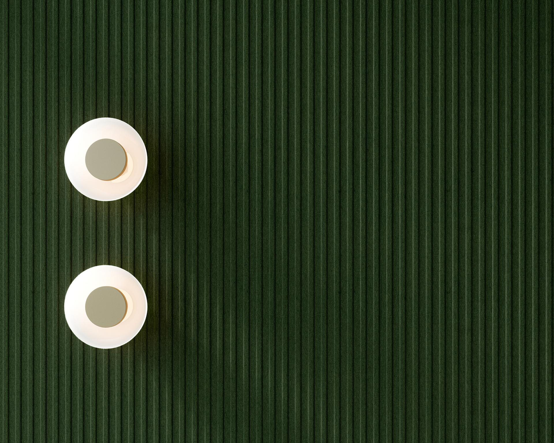 Two white lights with greenish-gray bases are placed on a ribbed green acoustic felt wall, positioned in the upper left corner of the image. The rest of the wall is unoccupied, creating a minimalist and balanced composition.
