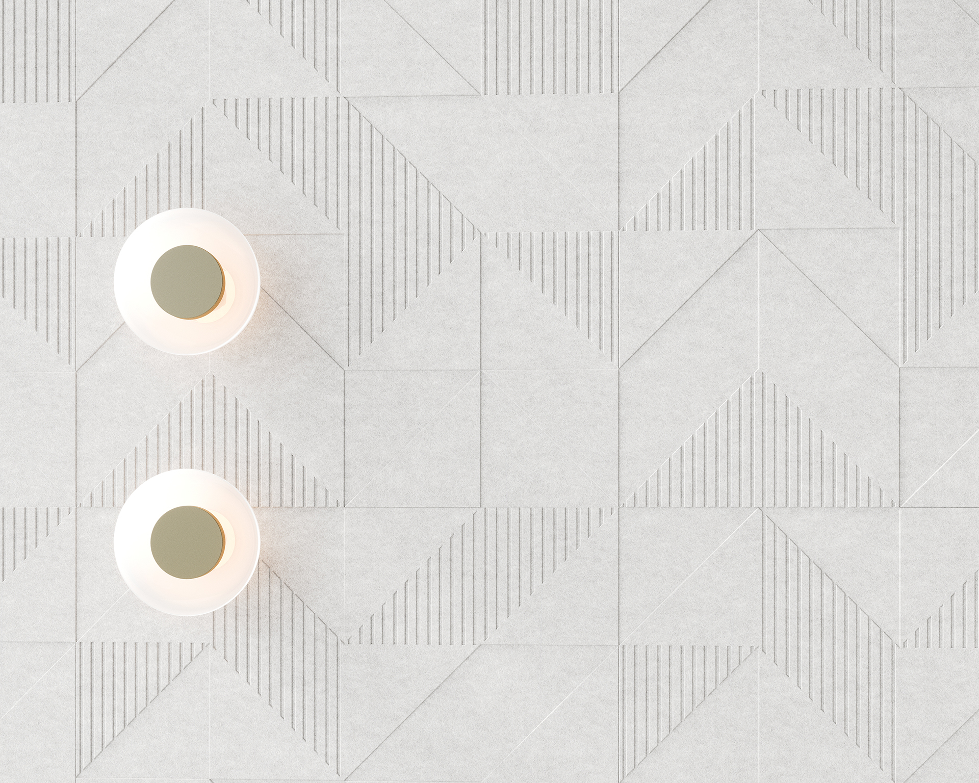 Two round ceiling lights on a decorative acoustic felt wall with a modern geometric pattern of triangles and lines in light gray. The lights are positioned on the left side, casting soft illumination.