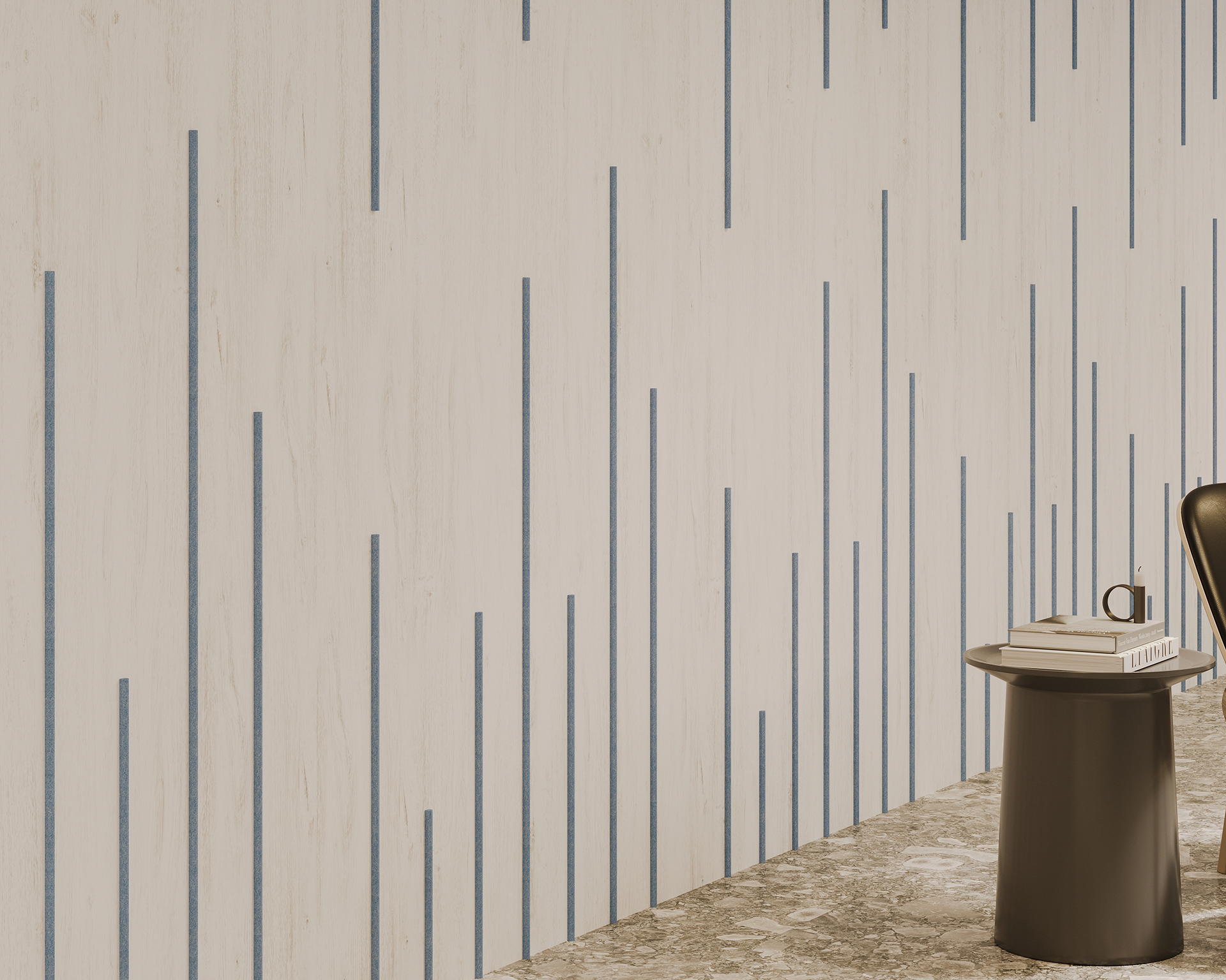A minimalist room features a textured acoustic felt beige wall with vertical blue lines. A sleek black side table holds several books and a white ceramic mug. The floor has a light stone pattern, adding a subtle elegance to the scene.