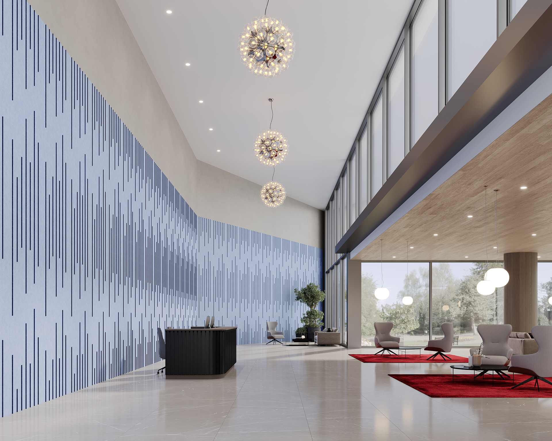 Modern office lobby with a high ceiling, featuring a blue and gray acoustic felt patterned wall. There are three decorative hanging lights, a black reception desk, red rugs, gray chairs, and large windows offering a view outside.