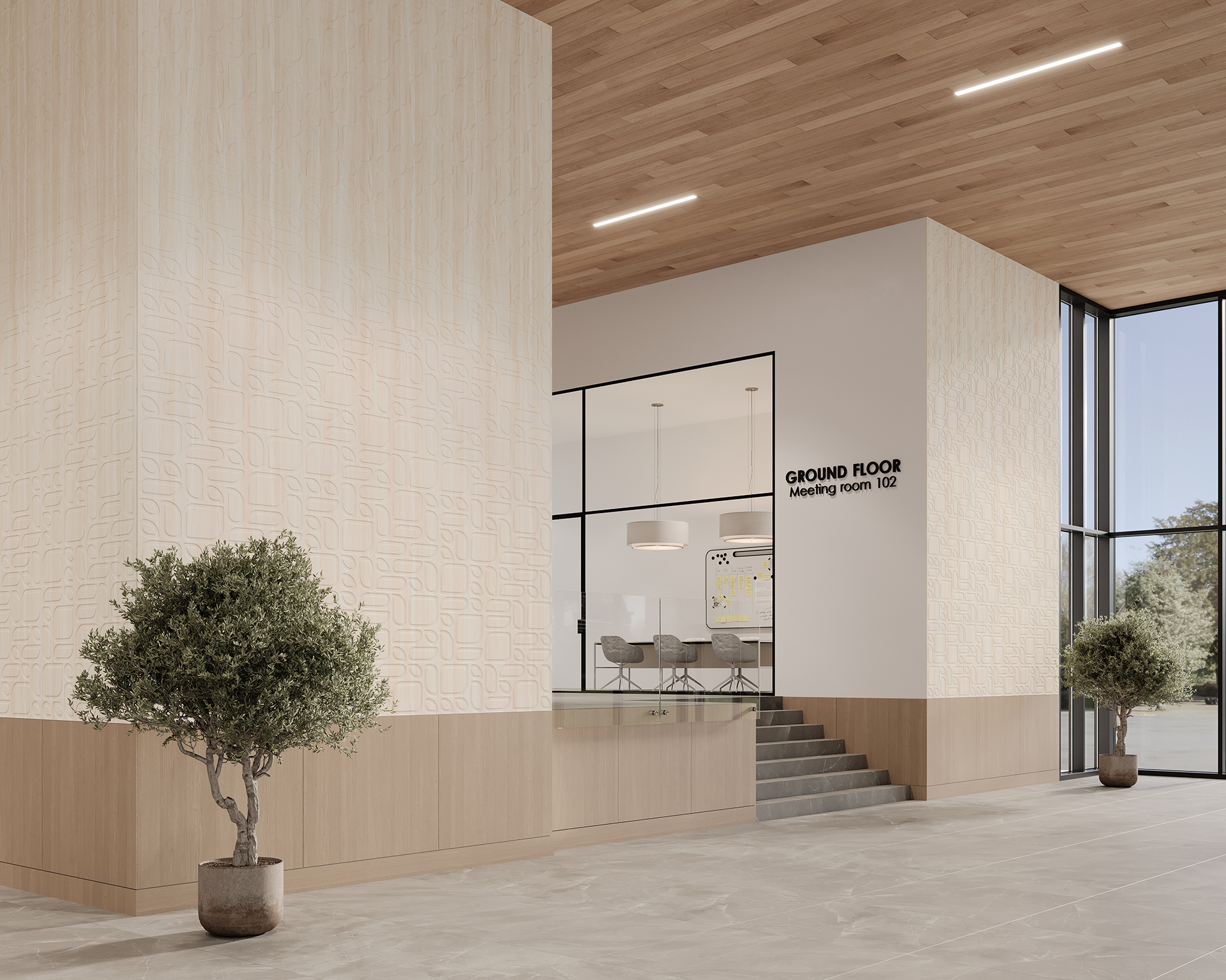 Spacious modern interior with tall ceilings, featuring woodgrain acoustic felt paneling and large windows. A conference room with glass walls is visible, labeled "Ground Floor Meeting Room 102." Two potted trees are placed near the entrance.