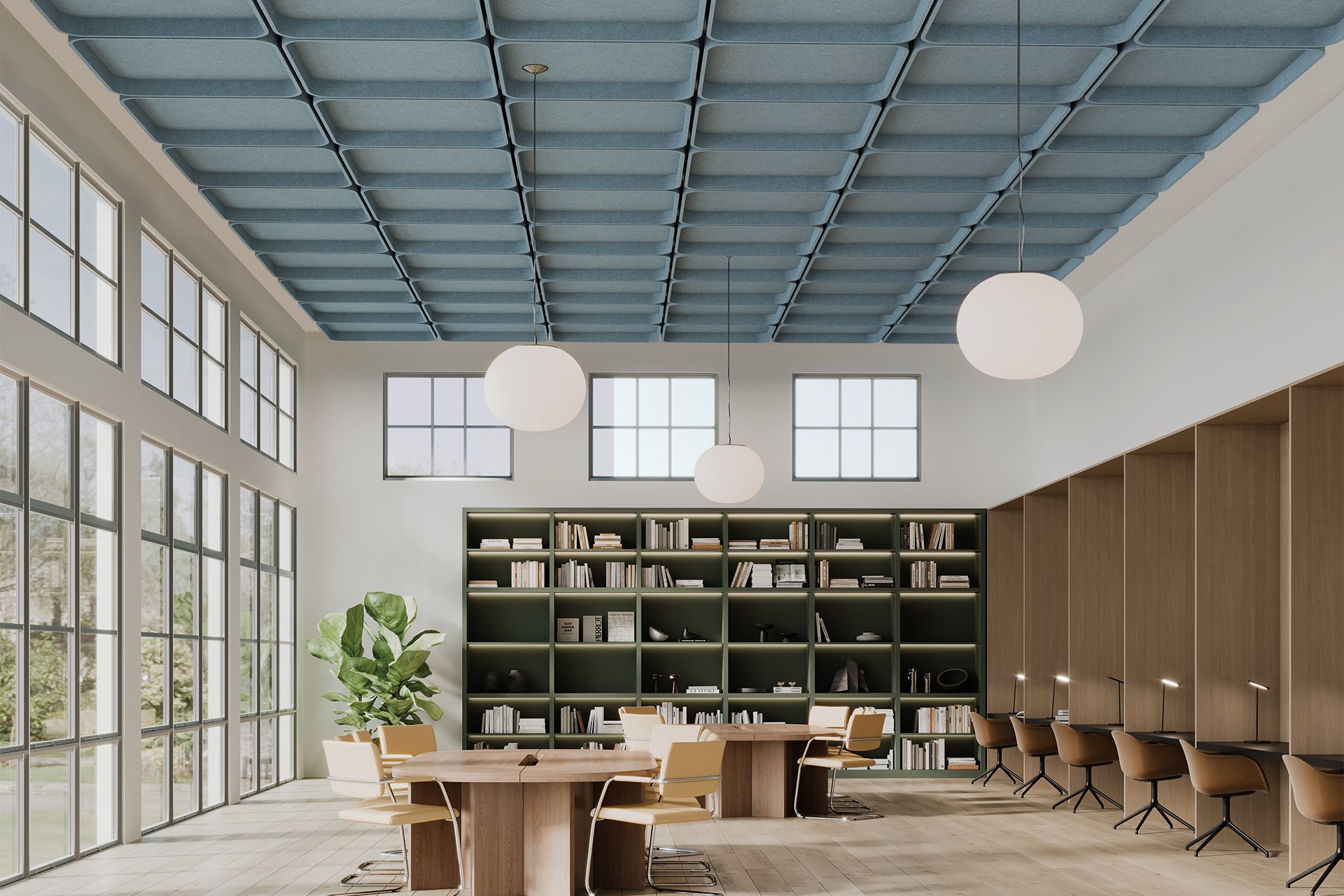 Spacious modern library with large windows and a green wall of bookshelves. Round tables and chairs align the room, and three spherical lamps hang from the textured acoustic felt ceiling. Natural light brightens the interior, with a view of greenery outside.