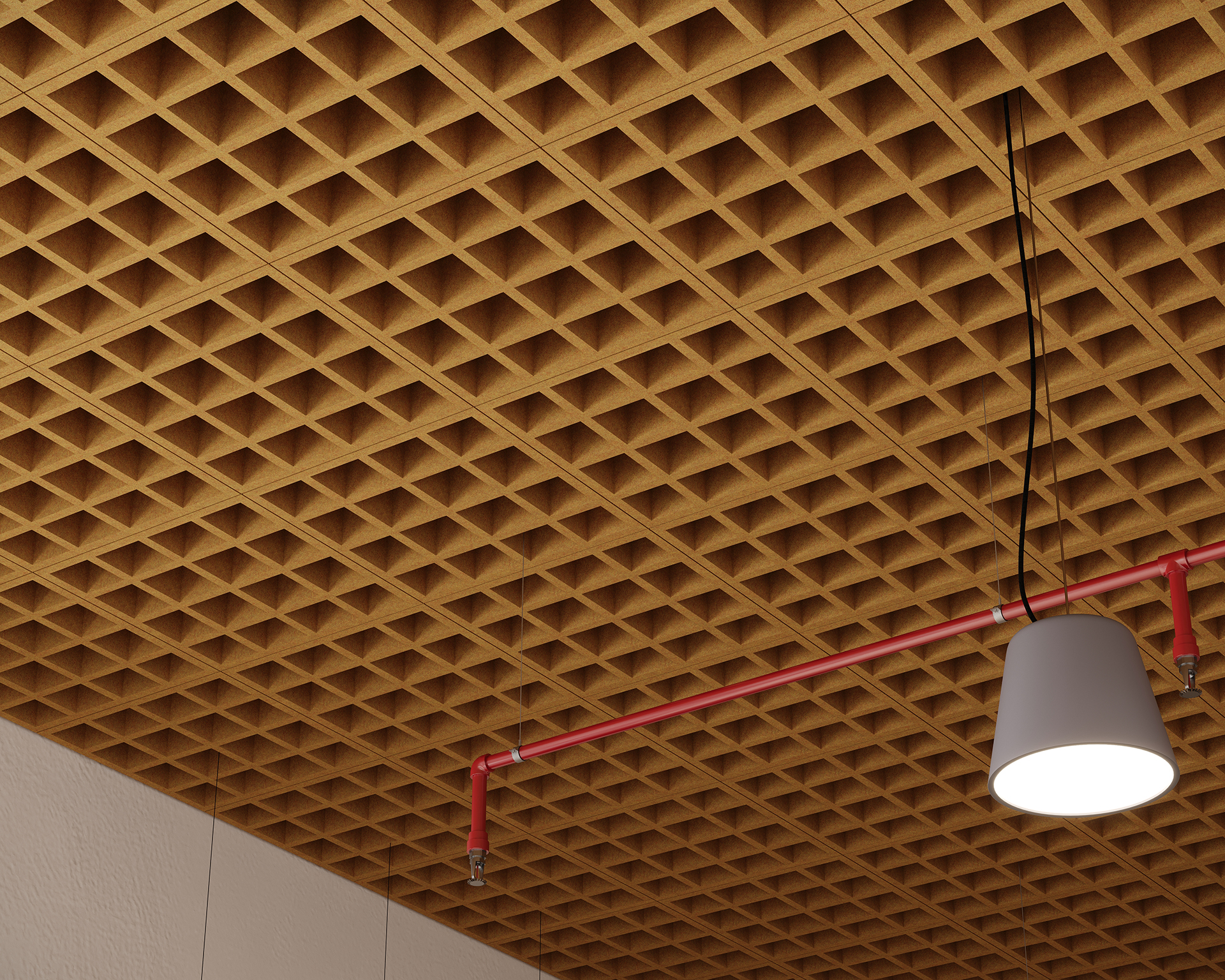View of a ceiling featuring a grid-like acoustic felt design, with a red pipe running parallel to the ceiling. A pendant light with a white shade hangs down, suspended by a black cord. The wall is visible on the left side.