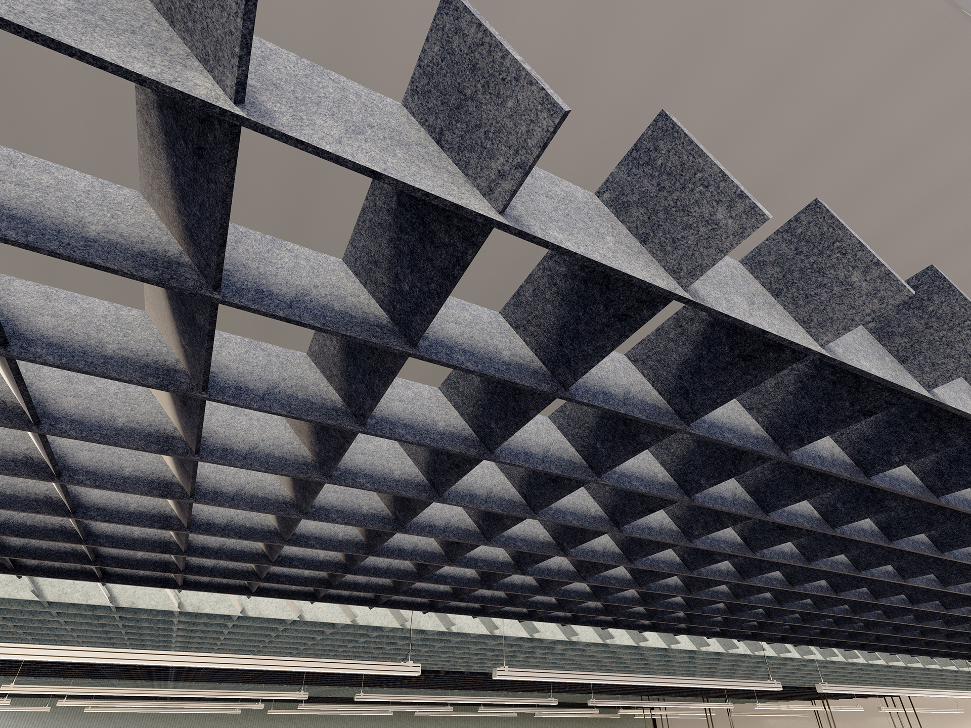 A close-up view of a modern ceiling with a geometric grid pattern made of square, blue-gray acoustic felt panels, creating a repeating checkerboard effect above fluorescent light fixtures.