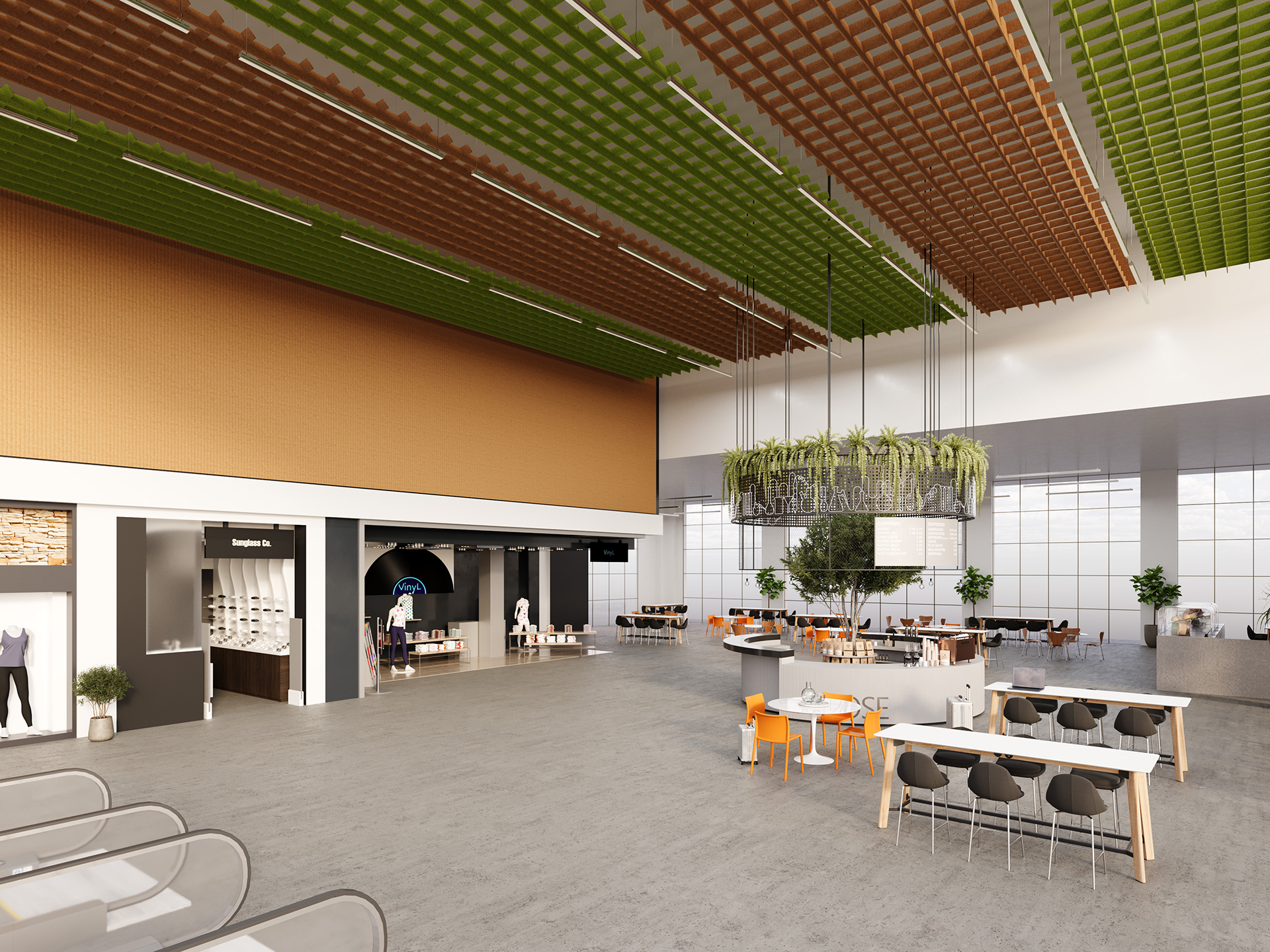Modern, spacious indoor area with high ceilings, large windows, and green acoustic felt clouds above. Features tables, chairs, plants, storefront displays, and a mix of communal and individual seating arrangements.