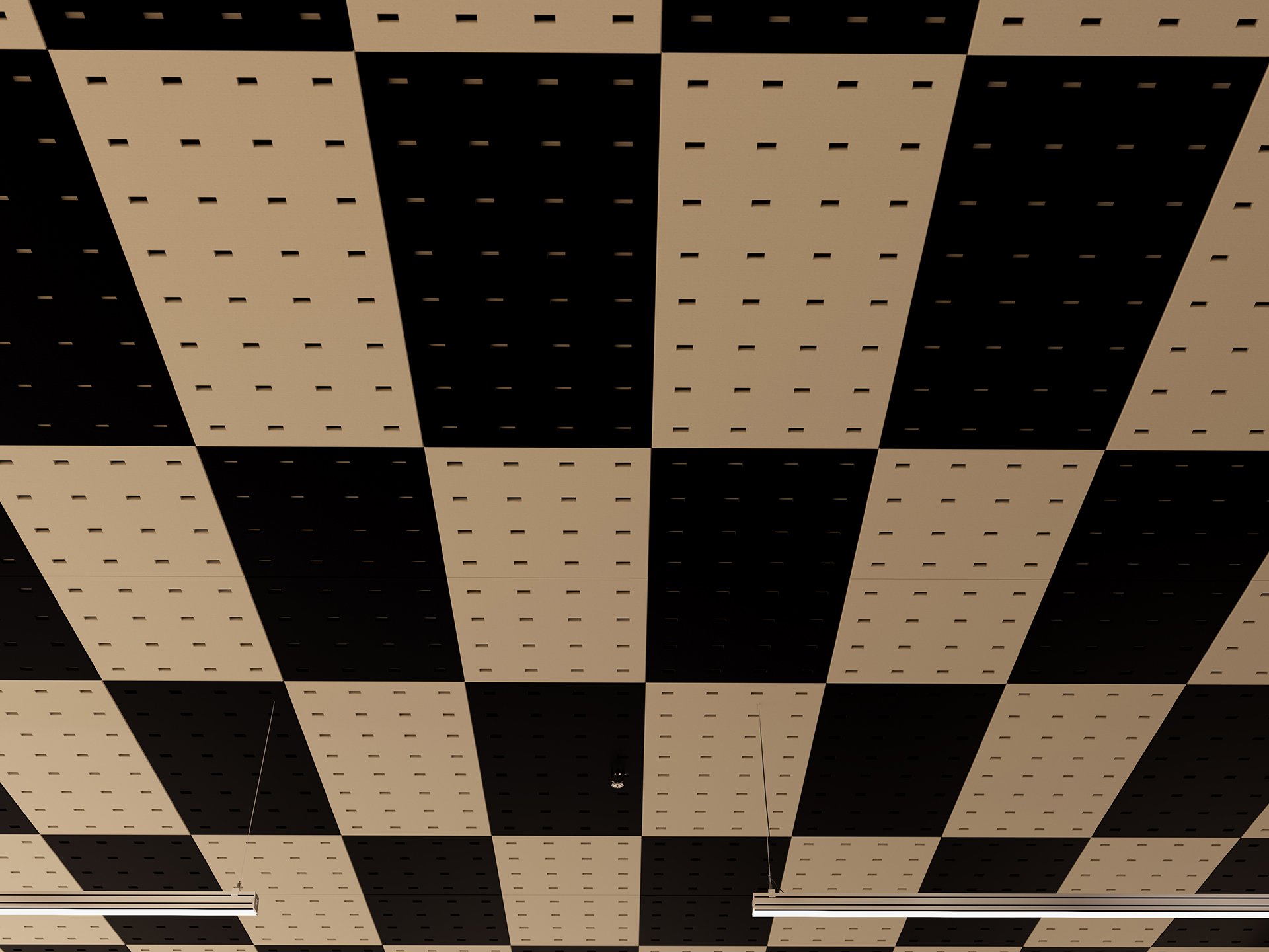 A ceiling with a checkerboard pattern of alternating black and beige acoustic felt panels, each with a grid of small square holes. Two thin, white light fixtures hang down.