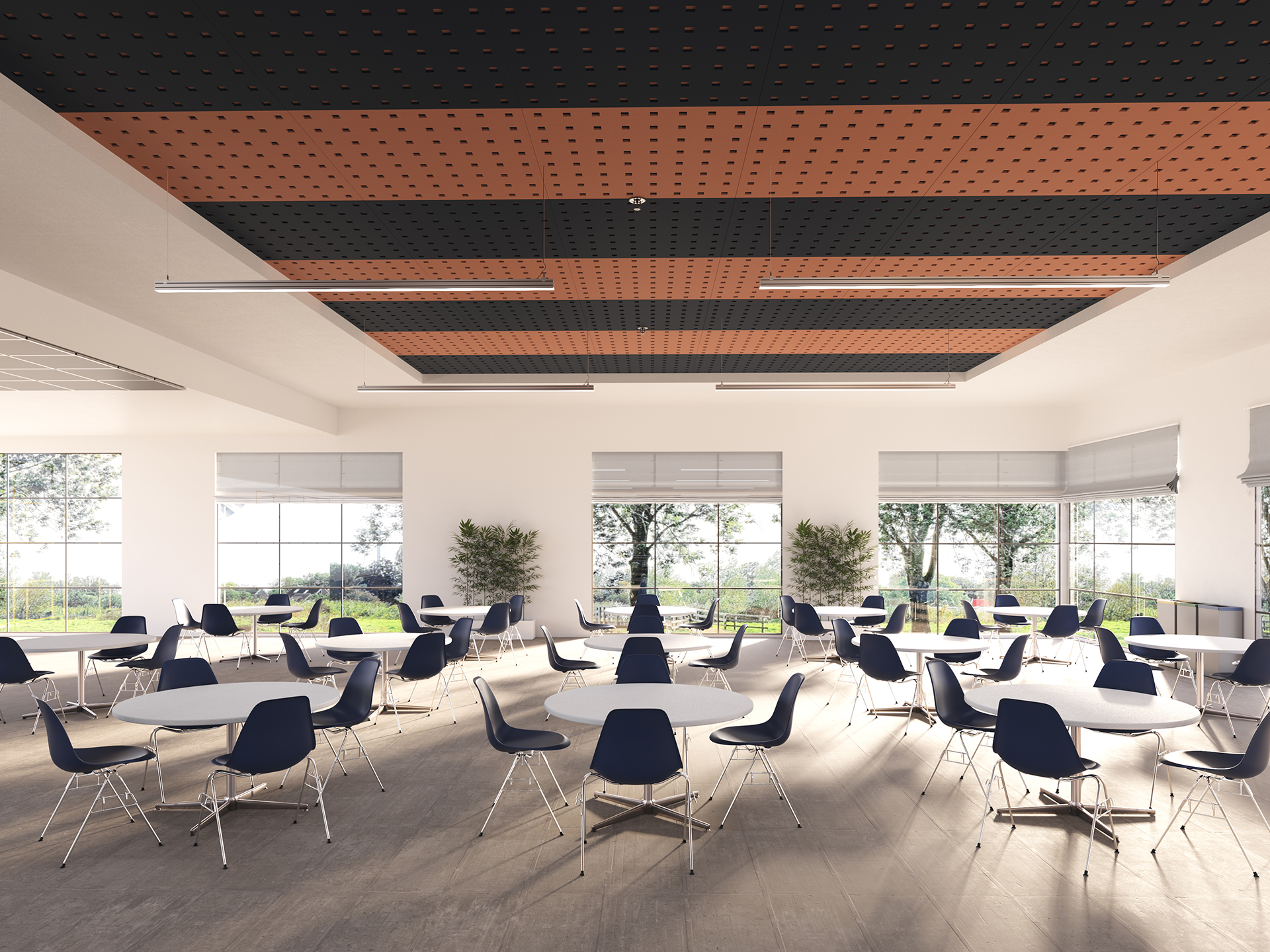 A bright, modern cafeteria with round tables and navy chairs, large windows letting in natural light, and plants by the walls. The ceiling features a pattern of black and light orange acoustic felt panels.
