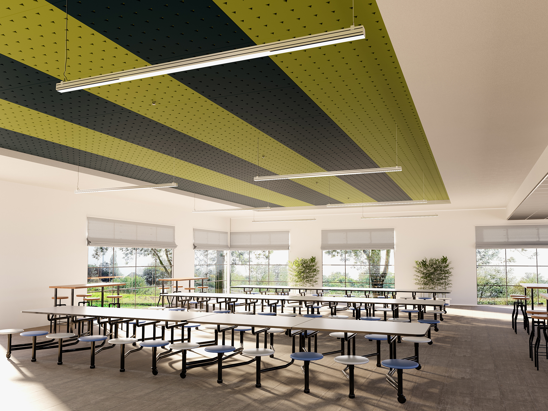 A bright cafeteria with long tables and round stools, large windows letting in natural light, green plants, and a ceiling featuring alternating green and black acoustic felt panels.
