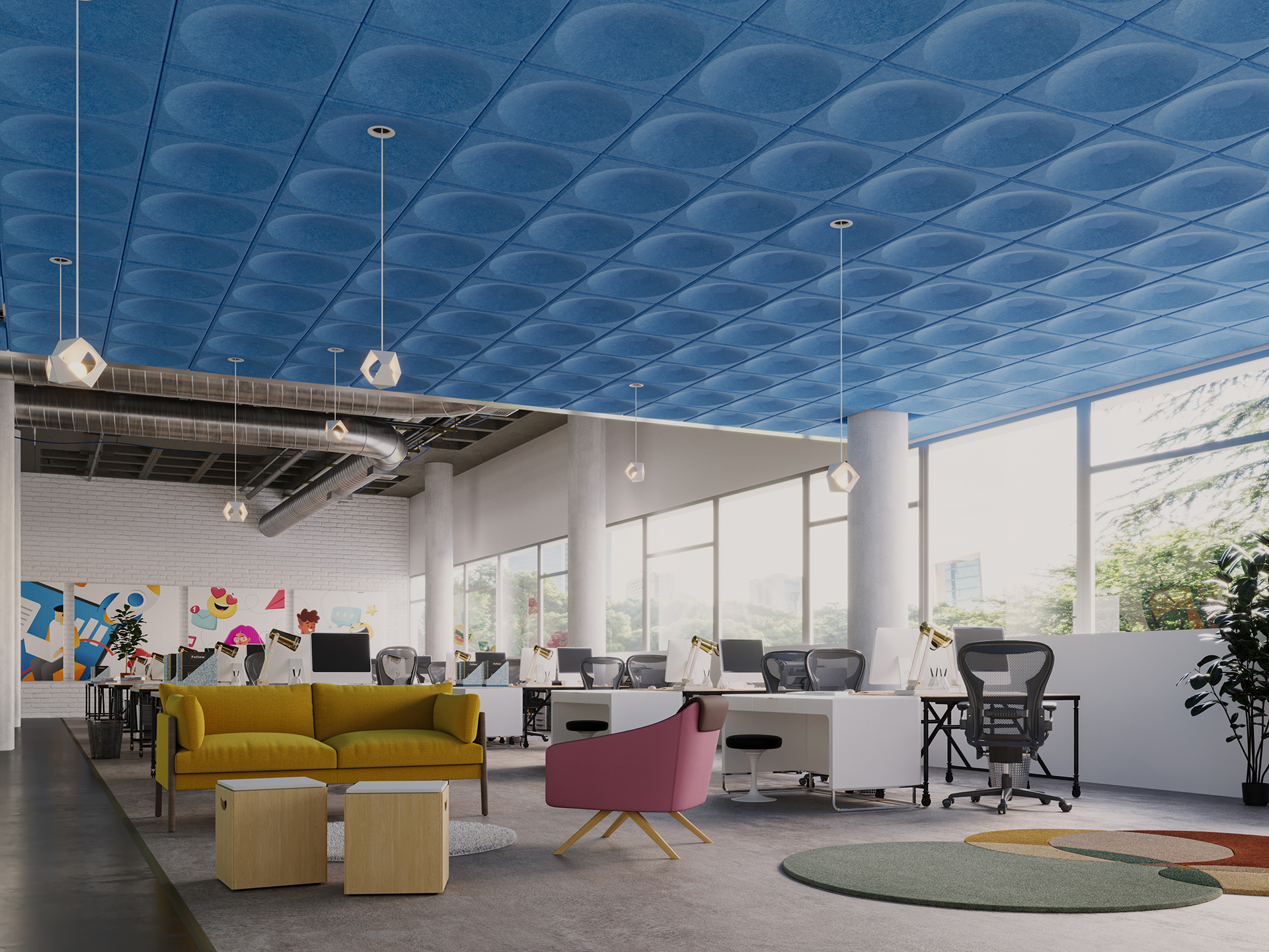 Modern office space with colorful furniture, including a yellow sofa and pink chair, white desks with computers, large windows, a blue patterned acoustic felt ceiling, and wall art in the background.