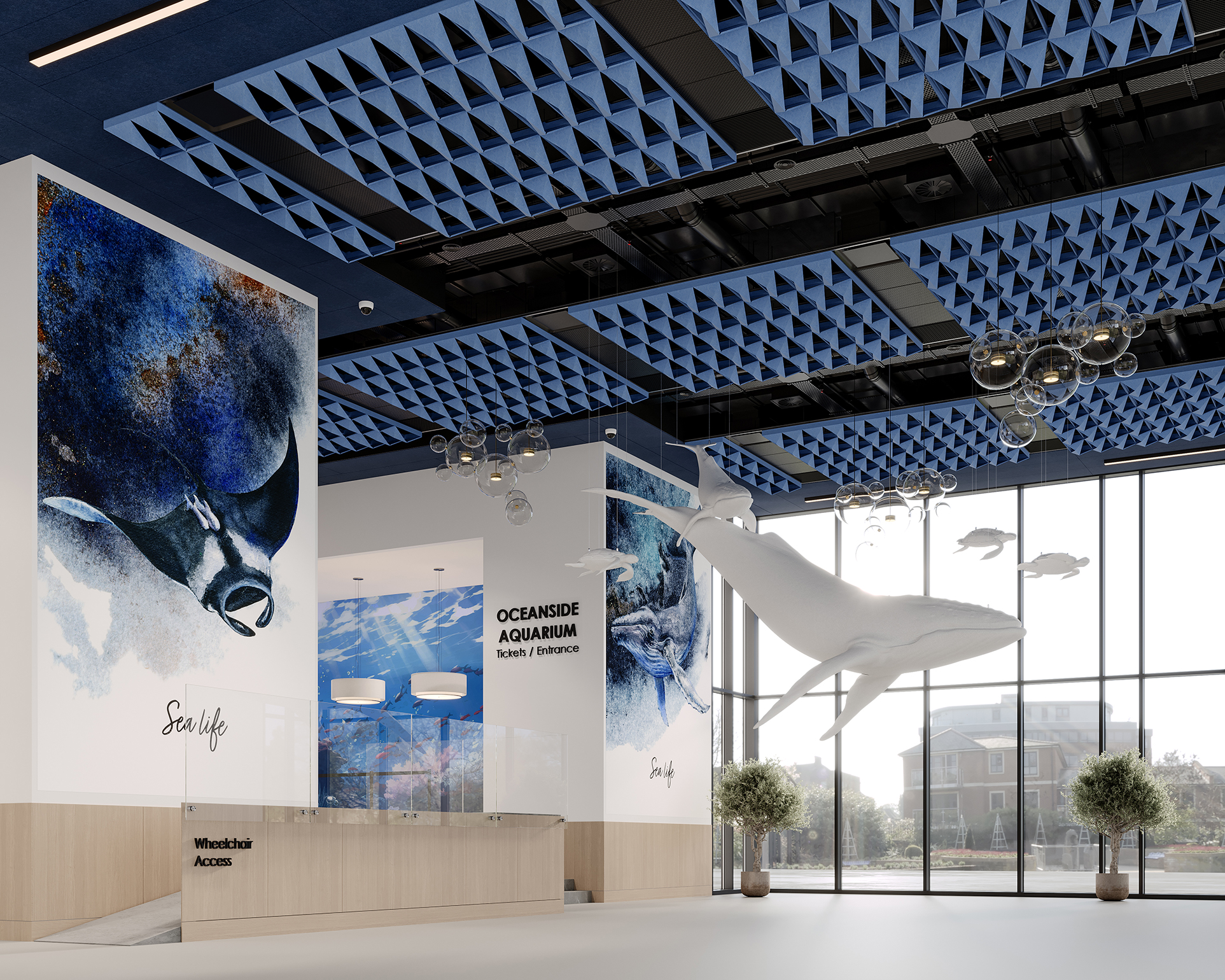 A modern aquarium lobby with blue acoustic panels on the ceiling, large marine animal murals, a whale sculpture suspended above, and a reception desk labeled "Oceanside Aquarium" with large windows in the background.