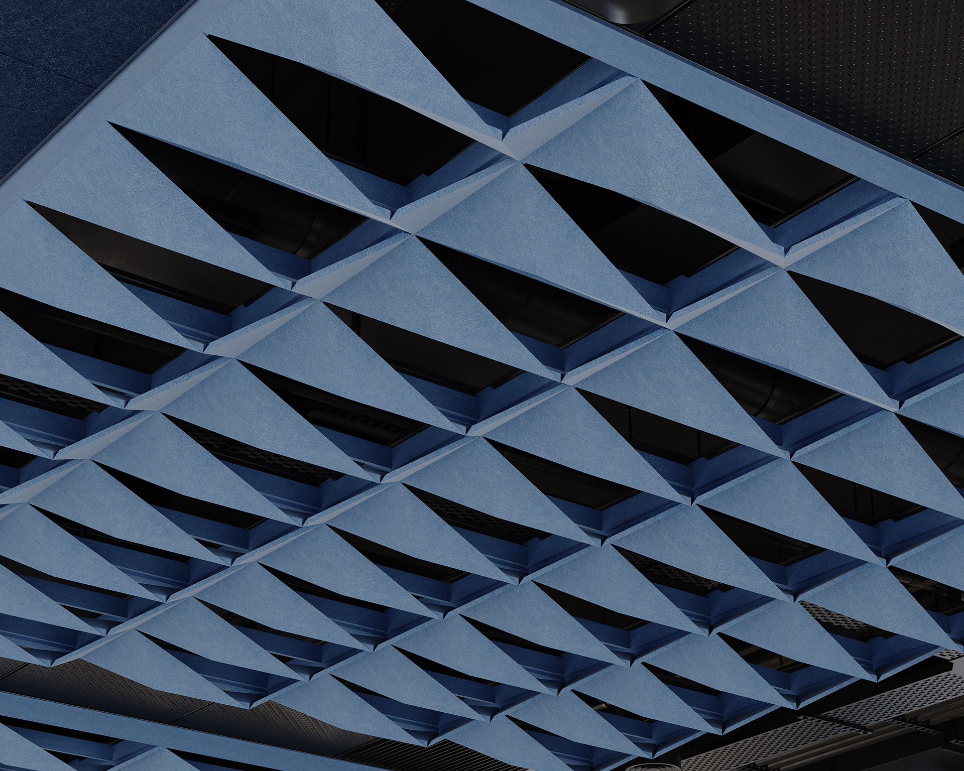 Close-up view of a modern blue geometric acoustic felt ceiling with repeating diamond-shaped, three-dimensional patterns and open spaces, creating a visually striking architectural design.