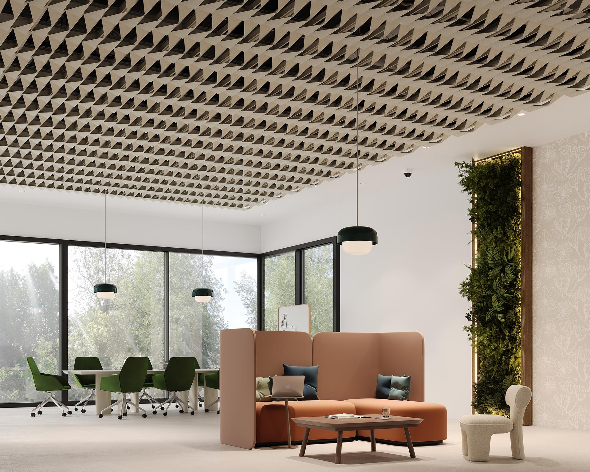 Modern office lounge with brown sofas, coffee table, and green chairs at a meeting table. Large windows let in natural light. Ceiling features geometric acoustic felt panels; a green vertical garden decorates one wall.