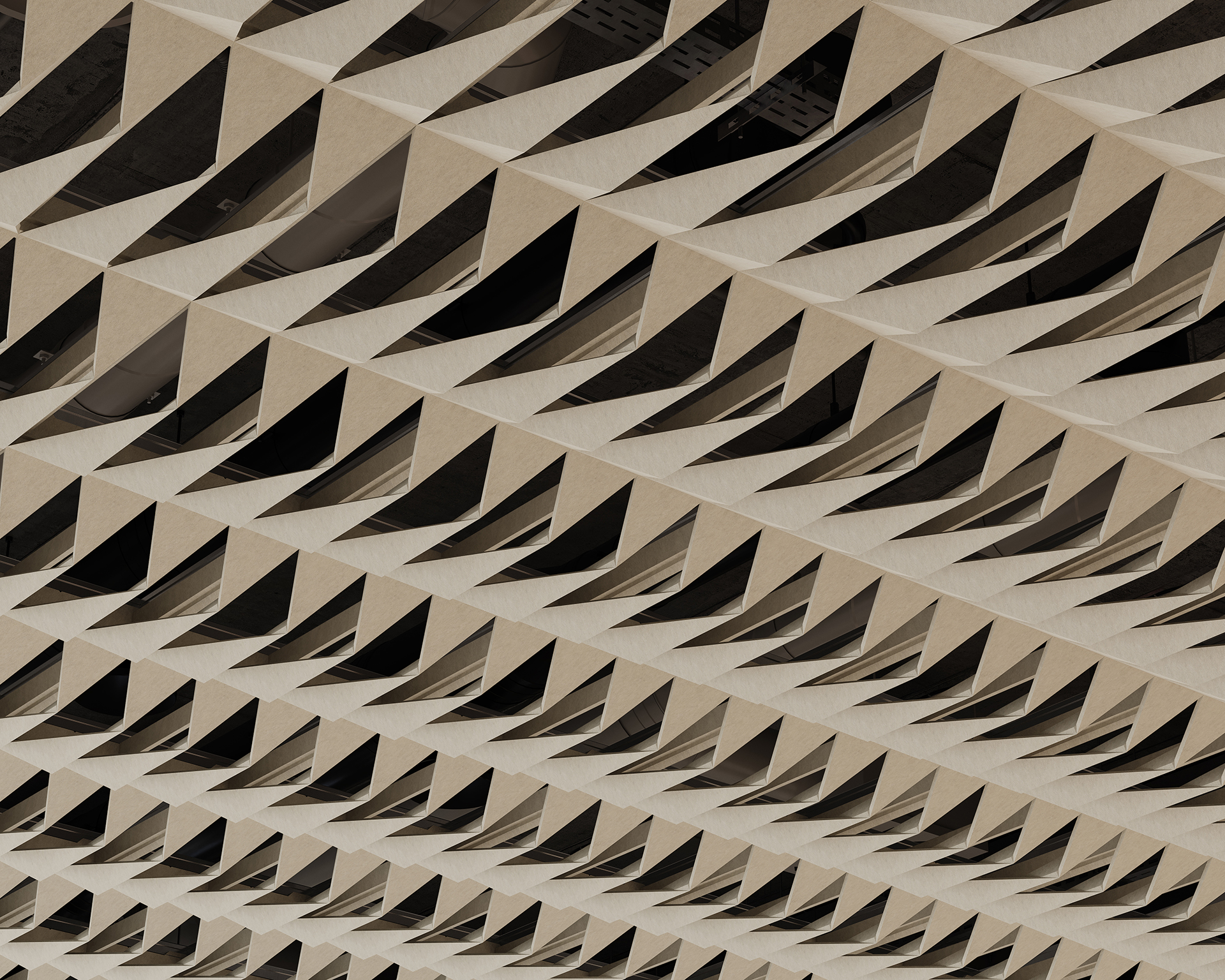 Geometric acoustic felt ceiling with repeating triangular cutouts in a grid pattern, creating a dynamic, modern architectural design with light and shadow contrasts.