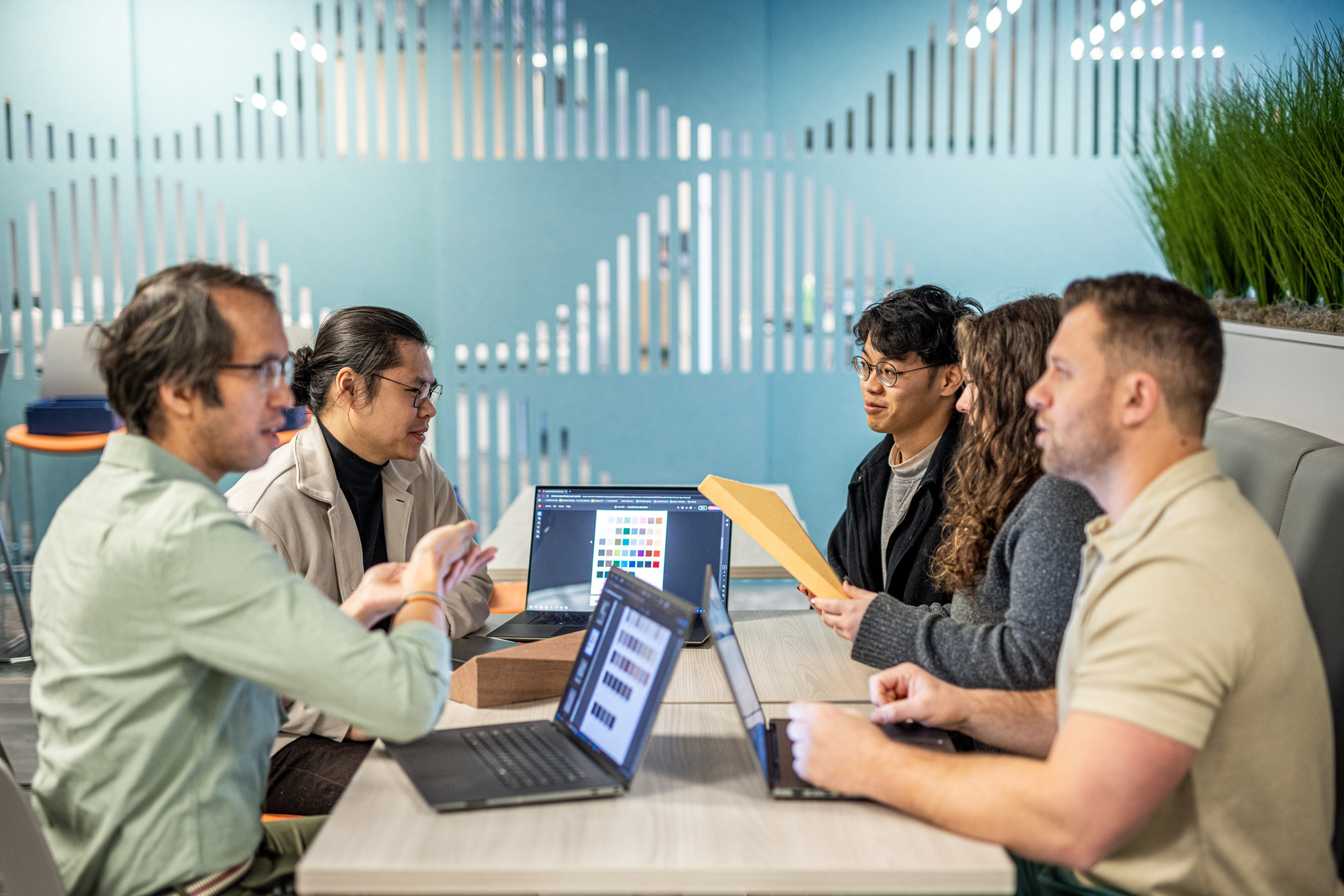 Team members working together across a table