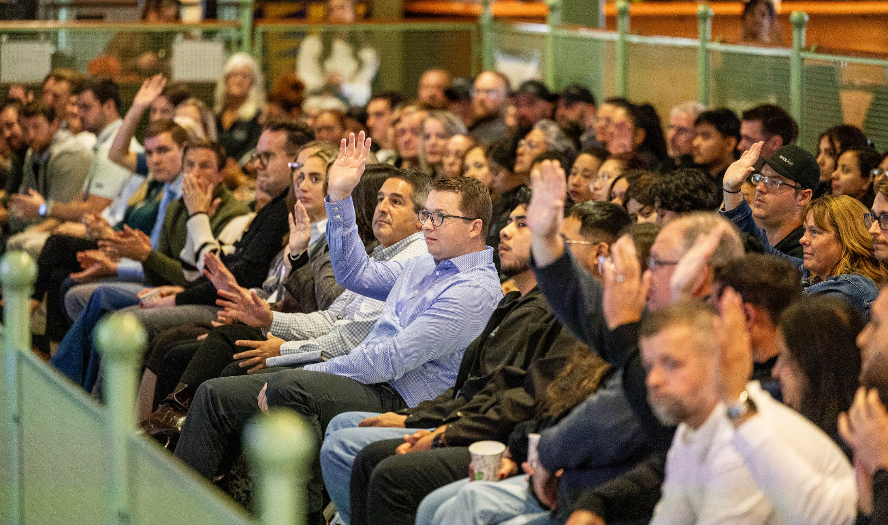 Team members gathered together at quarterly town hall presentation