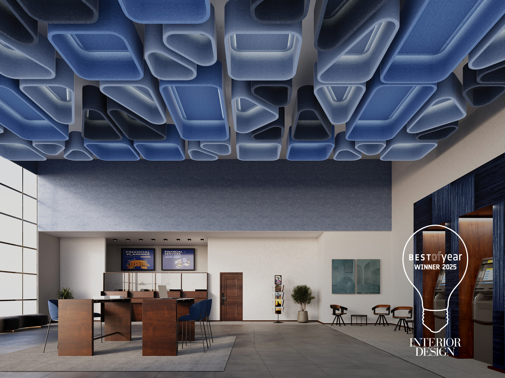 Modern lobby with a high ceiling featuring geometric blue panels, a seating area with tables and chairs, tall windows, and an award decal reading "Best of Year Winner 2025, Interior Design" on the wall.