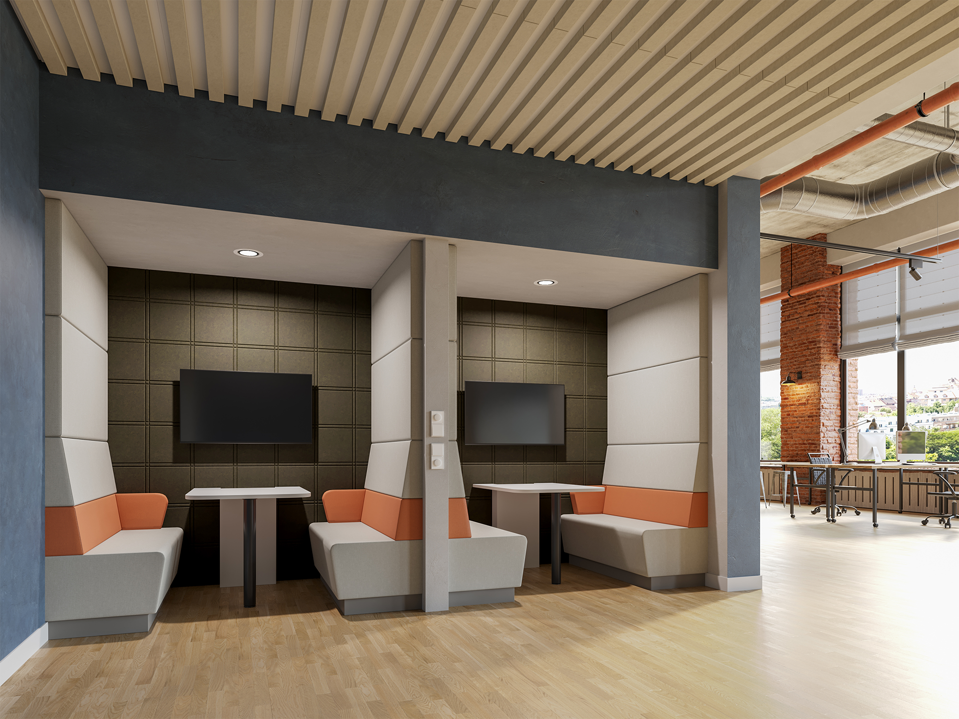 Two modern office booths with cushioned seats, tables, and wall-mounted TVs are set into a wall. The space features light wood flooring, acoustic felt walls, an open ceiling, and partial views of large windows and more seating in the background.