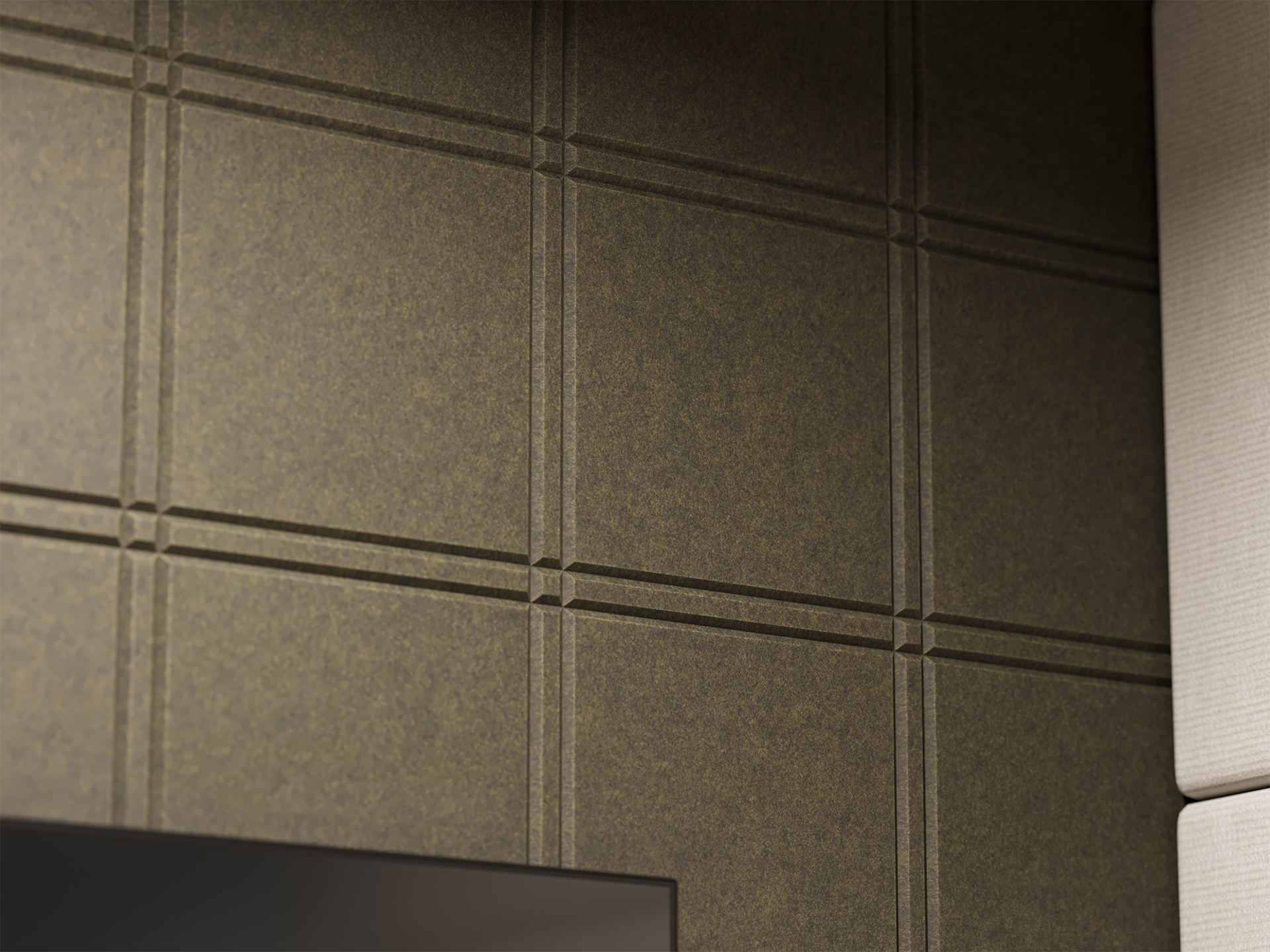 Close-up of a textured acoustic felt wall with a grid pattern of raised lines intersecting at square points. Part of a beige upholstered surface and the top edge of a black screen are visible in the corners.