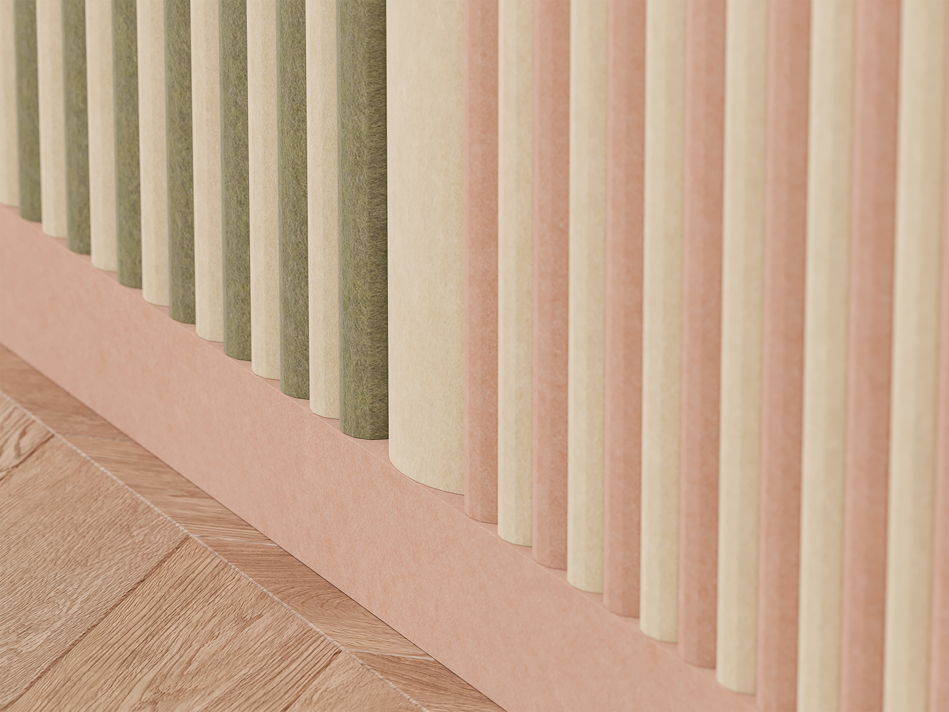 Close-up of vertical acoustic felt slats in soft pastel colors—beige, green, and pink—set against a light pink wall and wooden floor with a herringbone pattern. The image has a modern, minimal aesthetic.
